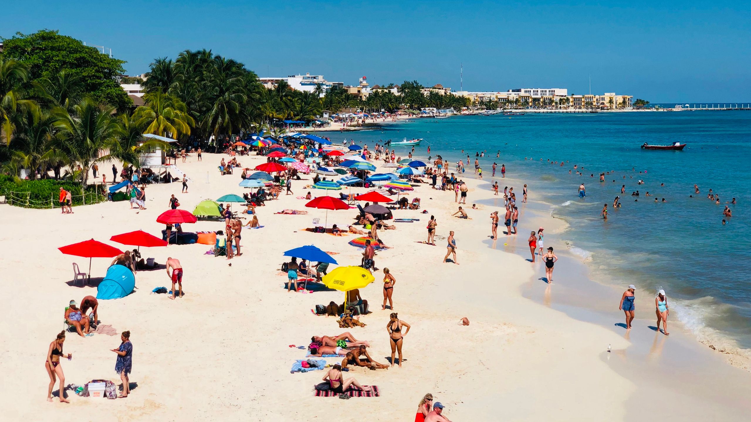 People enjoy a day on the beach in Playa del Carmen, Mexico.