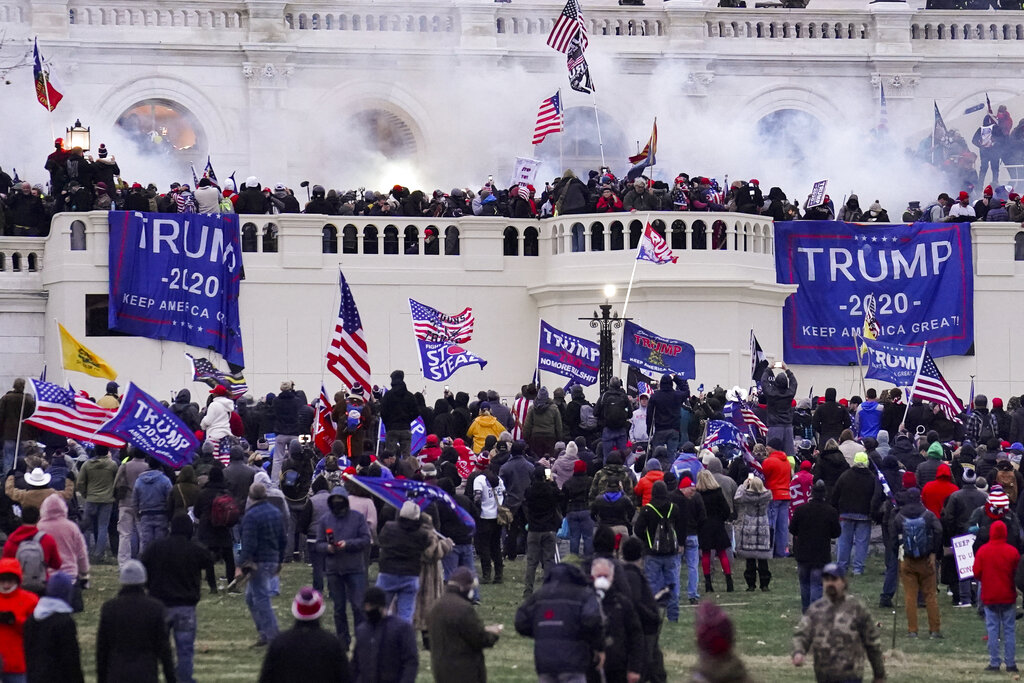 Rioters supporting President Donald Trump storm the Capitol in Washington. The House is poised to launch a new investigation of the Jan. 6 Capitol insurrection on Wednesday, Jan. 30, with expected approval of a 13-person select committee to probe the violent attack. (AP Photo/John Minchillo, File)