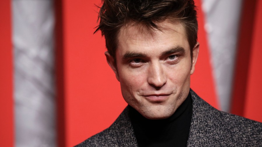 Robert Pattinson poses for photographers upon arrival for the screening of the film 'The Batman' in London Wednesday, Feb. 23, 2022