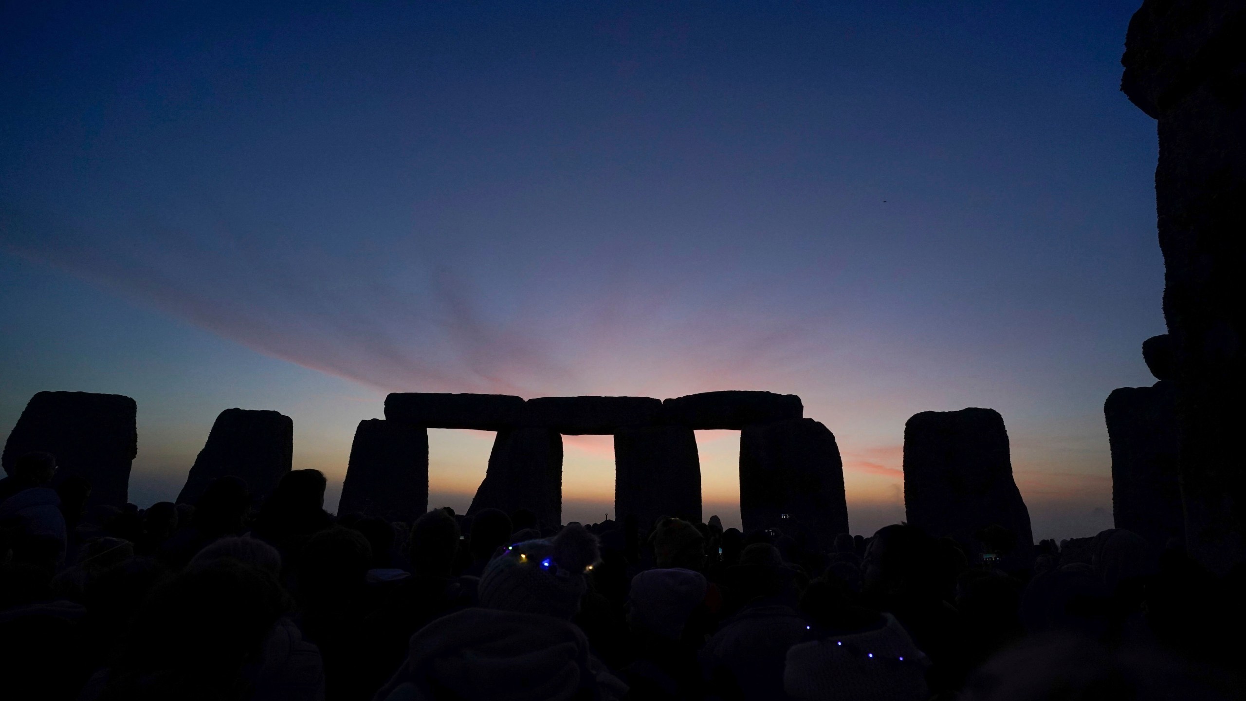 Stonehenge in front of sunrise.