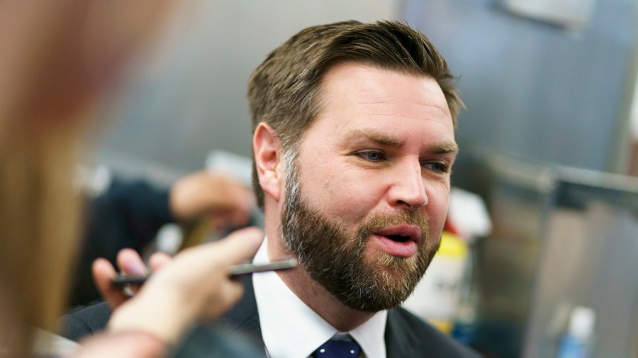 Sen. J.D. Vance speaks to reporters as he leaves an all-senators briefing in the Capitol.