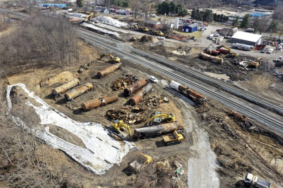 FILE - A view of the scene Friday, Feb. 24, 2023, as the cleanup continues at the site of a Norfolk Southern freight train derailment that happened on Feb. 3, in East Palestine, Ohio. On Tuesday, Feb. 28, in the wake of a fiery Ohio derailment and other recent crashes, federal regulators urged that freight railroads should reexamine the way they use and maintain the detectors along the tracks that are supposed to spot overheating bearings. (AP Photo/Matt Freed, File)