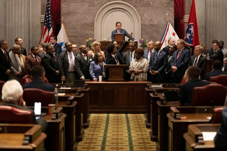 Former Rep. Justin Pearson, D-Memphis, waves to his supporters in the gallery as he delivers his final remarks on the floor of the House chamber as he is expelled from the legislature Thursday, April 6, 2023, in Nashville, Tenn. Tennessee Republicans ousted two of three House Democrats for using a bullhorn to shout support for pro-gun control protesters in the House chamber. (AP Photo/George Walker IV)