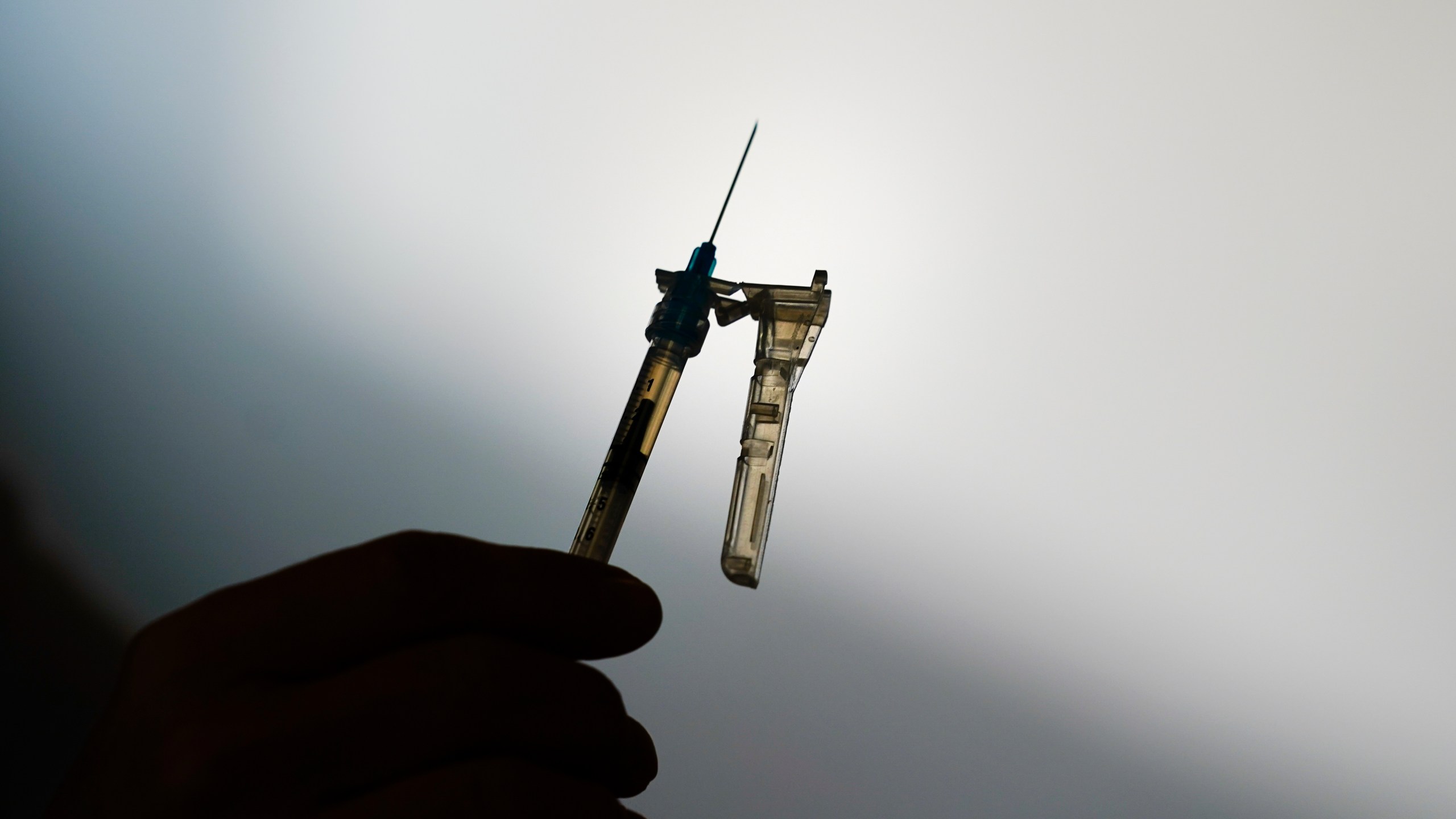 FILE - A syringe is prepared at a clinic in Norristown, Pa., Dec. 7, 2021. The Environmental Protection Agency proposed Tuesday, April 11, 2023, to limit the use of the chemical ethylene oxide after finding higher than expected cancer risk at facilities that use it to sterilize billions of medical devices each year. (AP Photo/Matt Rourke, File)