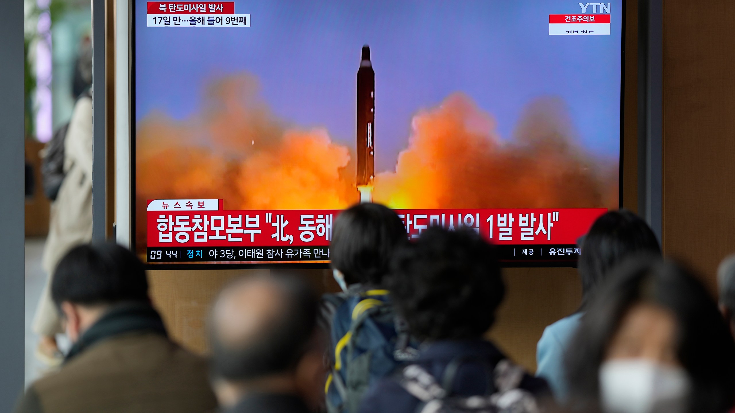 A TV screen is seen reporting North Korea's missile launch with file footage during a news program at the Seoul Railway Station in Seoul, South Korea, Thursday, April 13, 2023. North Korea launched a ballistic missile that landed in the waters between the Korean Peninsula and Japan on Thursday, prompting Japan to order residents on an island to take shelter as a precaution. The order has been lifted. (AP Photo/Lee Jin-man)