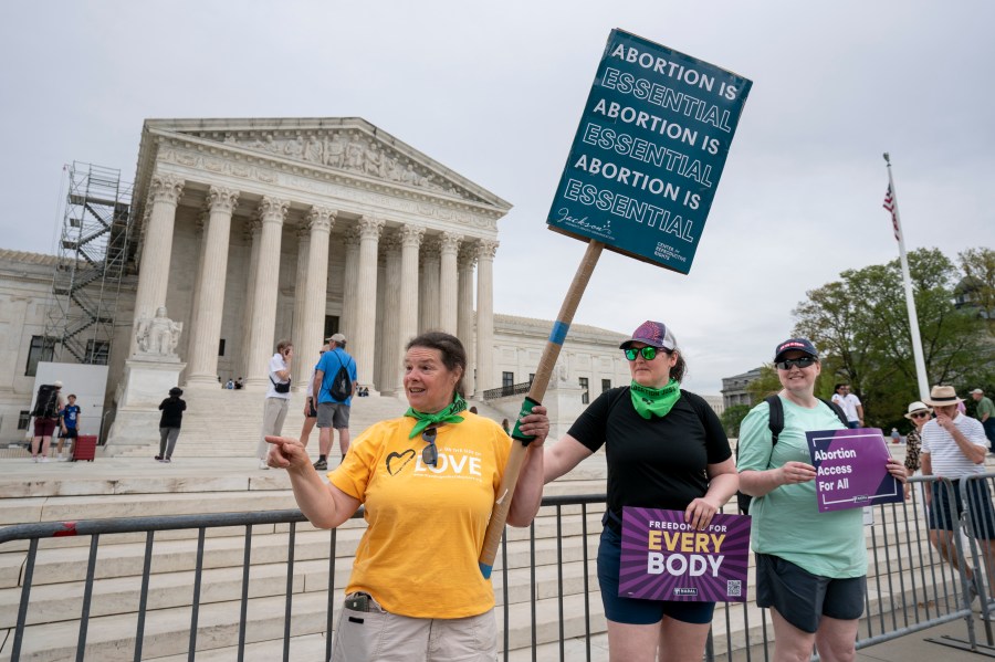 Doris Marlin, left, of Silver Spring, Md., and fellow activists demonstrate in front of the Supreme Court on Capitol Hill in Washington, Friday, April 14, 2023. The Supreme Court said Friday it was temporarily keeping in place federal rules for use of an abortion drug, while it takes time to more fully consider the issues raised in a court challenge. (AP Photo/J. Scott Applewhite)