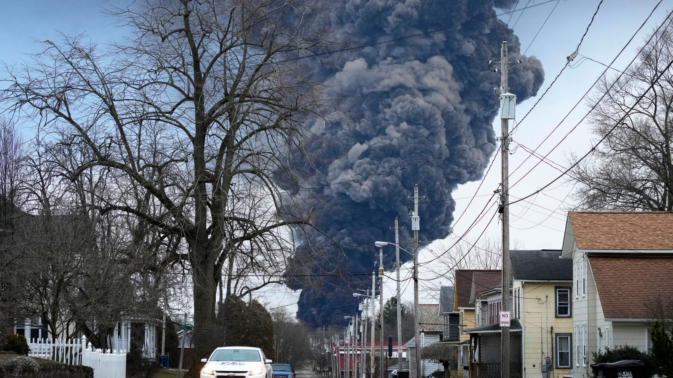 FILE - A black plume rises over East Palestine, Ohio, as a result of a controlled detonation of a portion of the derailed Norfolk Southern trains, on Feb. 6, 2023. Norfolk Southern CEO Alan Shaw is set to testify before an Ohio Senate rail safety panel on Tuesday, April 18, more than two months after the fiery train derailment rocked the village of East Palestine. (AP Photo/Gene J. Puskar, File)