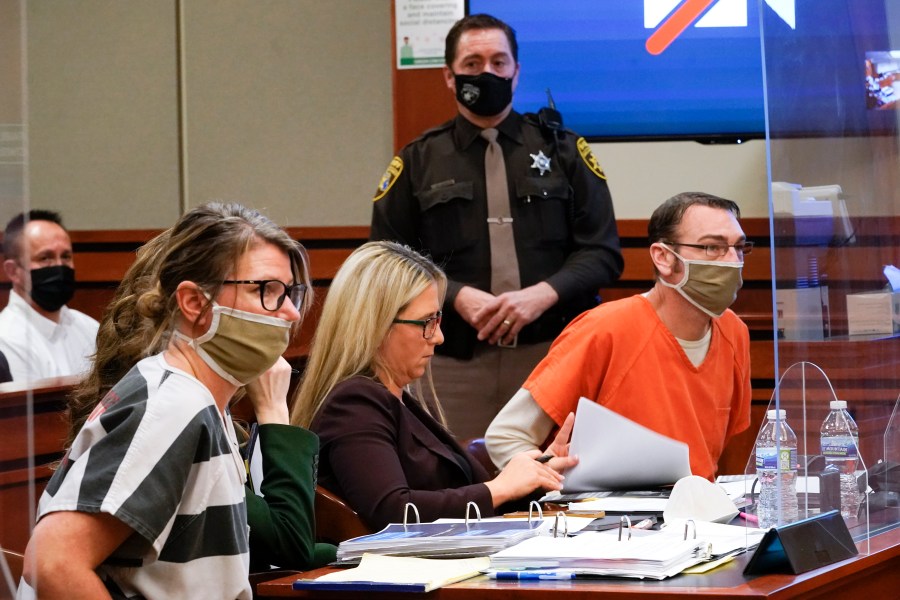 FILE - Jennifer Crumbley, left, and James Crumbley, right, the parents of Ethan Crumbley, a teenager accused of killing four students in a shooting at Oxford High School in Oxford, Mich., appear in court for a preliminary examination on involuntary manslaughter charges in Rochester Hills, Mich., Feb. 8, 2022. Criminal investigations of parents and school employees are rare following a school shooting, experts say. But they appear to be gaining traction as communities demand accountability and new ways to prevent the violence. (AP Photo/Paul Sancya, File)