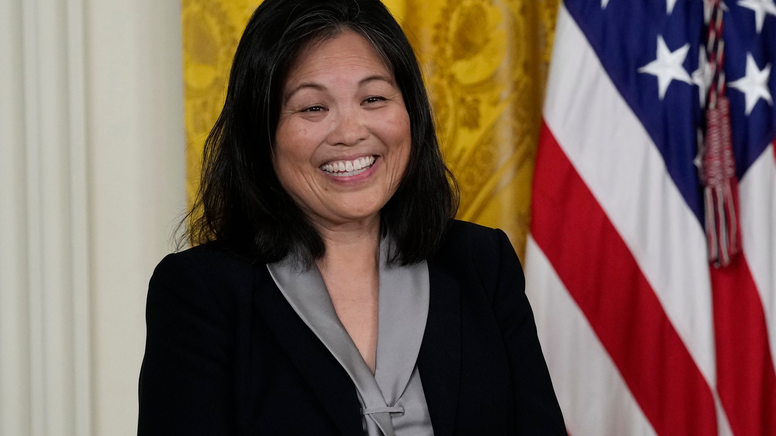 FILE - Julie Su, nominated by President Joe Biden to serve as the Secretary of Labor, listens as Biden speaks about her during an event in the East Room of the White House in Washington, Wednesday, March 1, 2023. Su, will testify to the Senate Thursday with key Democrats unwilling to voice support for her confirmation, creating uncertainty about her prospects in the narrowly-divided Senate. (AP Photo/Susan Walsh, File)