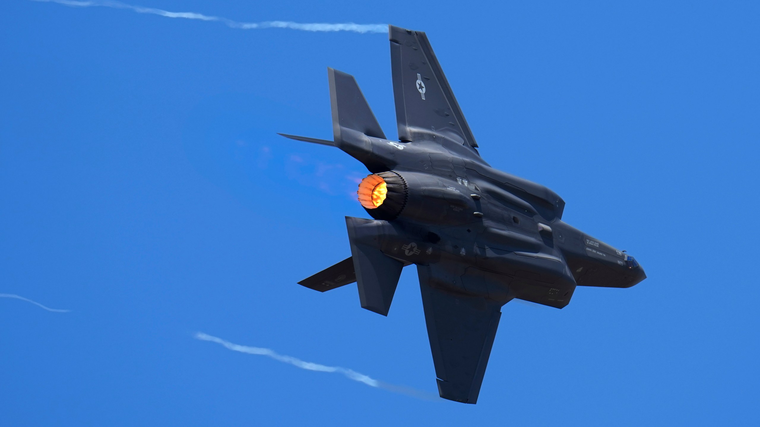 FILE - U.S. Air Force fighter aircraft F-35 performs aerobatic maneuvers on the second day of the Aero India 2023 at Yelahanka air base in Bengaluru, India, Tuesday, Feb. 14, 2023. An independent Sweden-based watchdog says the world military spending has grown for the eighth consecutive year in 2022 to an all-time high of $2240 billion leading to a sharp rise of 13% taking place in Europe, chiefly due to Russian and Ukrainian expenditure. (AP Photo/Aijaz Rahi, File)