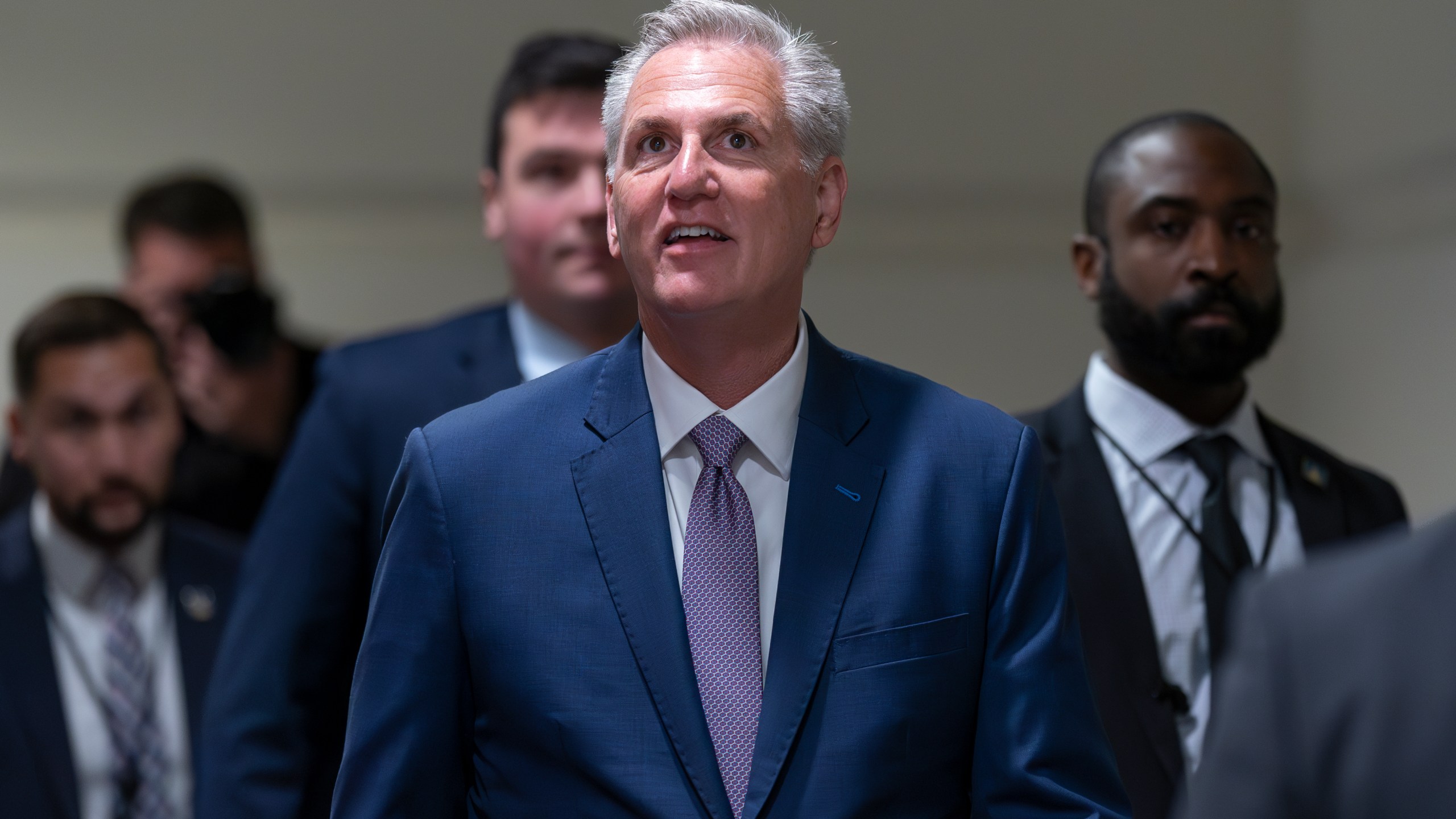 Speaker of the House Kevin McCarthy, R-Calif., arrives for a closed-door meeting with fellow Republicans as he pushes his sweeping debt ceiling package, at the Capitol in Washington, Wednesday, April 26, 2023. McCarthy is struggling to round up the votes for the bill, which would couple an increase of the country's debt ceiling with restrictions on federal spending. A final vote on the package is likely Thursday. (AP Photo/J. Scott Applewhite)