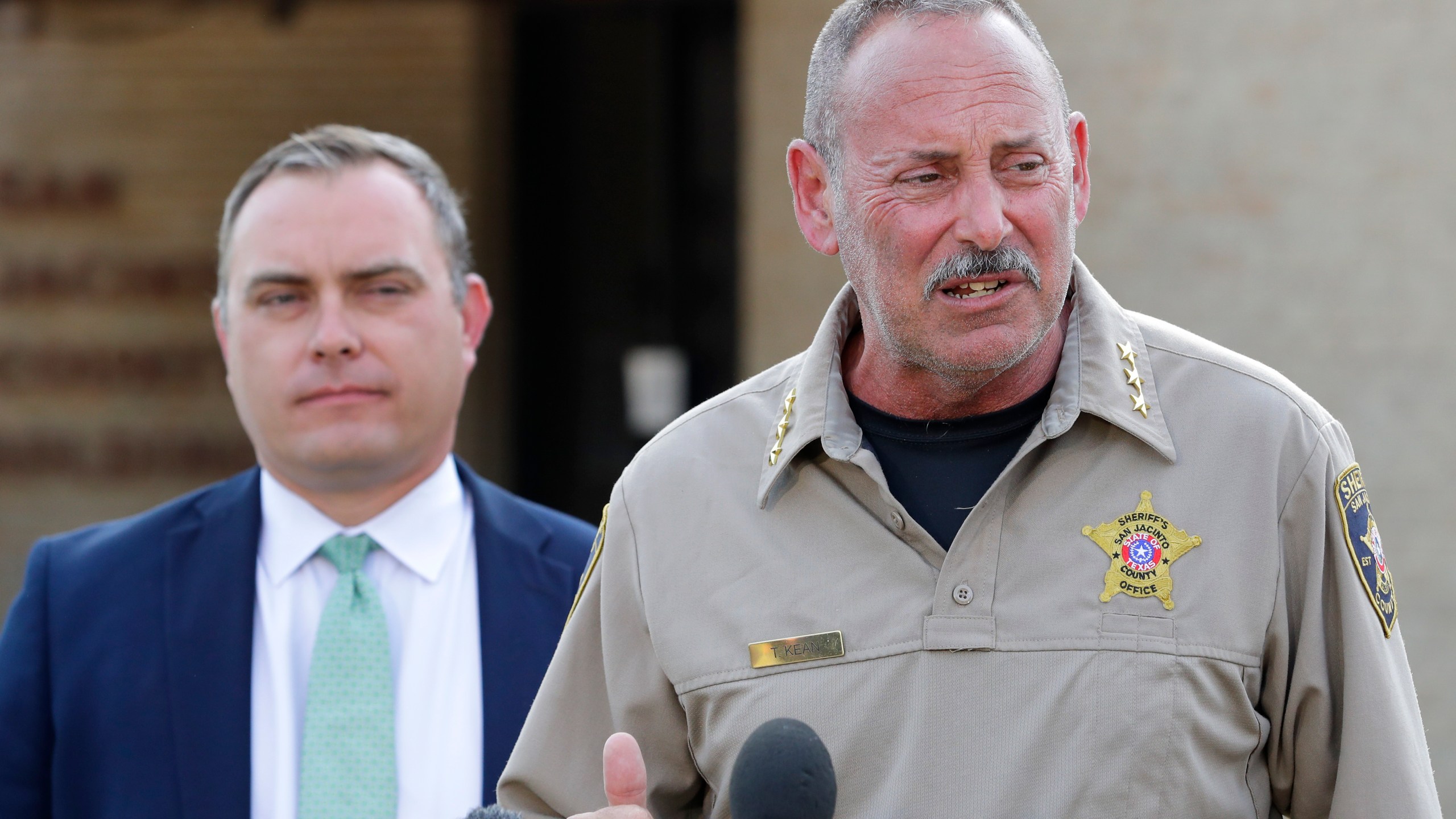 San Jacinto County Sheriff's Office chief deputy Tim Kean, right, introduces county district attorney Todd Dillon, left, during a news conference regarding suspect Francisco Oropeza at the San Jacinto County Public Safety Building Wednesday, May 3, 2023, in Coldspring, Texas. Oropeza, suspected of killing five of his neighbors Friday night, is in custody. (AP Photo/Michael Wyke)