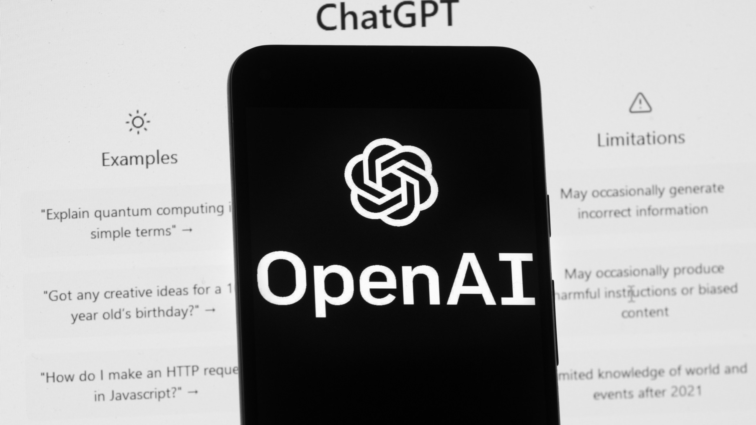 FILE - The OpenAI logo is seen on a mobile phone in front of a computer screen which displays the ChatGPT home Screen, on March 17, 2023, in Boston. Britain’s competition watchdog is opening a review of the artificial intelligence market, focusing on the technology underpinning chatbots like ChatGPT. The Competition Markets Authority said Thursday, May 4 it will look into the opportunities and risks of AI as well as the competition rules and consumer protections that may be needed. (AP Photo/Michael Dwyer, File)