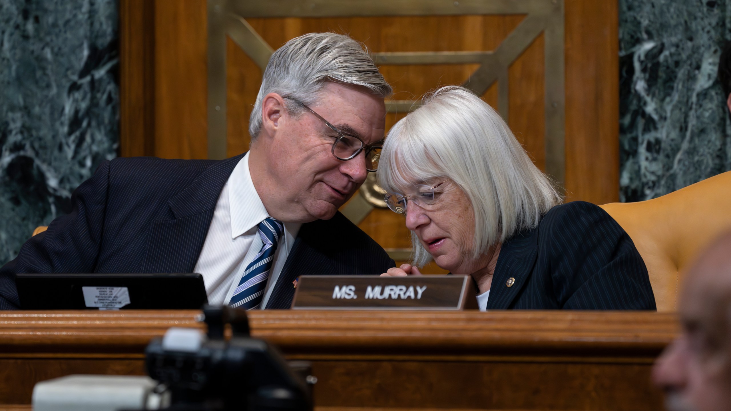 Senate Budget Committee Chairman Sheldon Whitehouse, D-R.I., confers with Sen. Patty Murray, D-Wash., right, during a hearing on the Republican proposal to address the debt limit which passed along party lines in the House last week, at the Capitol in Washington, Thursday, May 4, 2023. Senate Democrats are looking to pressure Republicans into resolving the impasse on the debt ceiling. (AP Photo/J. Scott Applewhite)