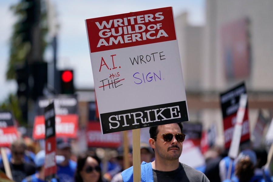 Members of the The Writers Guild of America picket outside Fox Studios on Tuesday, May 2, 2023, in Los Angeles. Hollywood writers picketing to preserve pay and job security outside major studios and streamers braced for a long fight at the outset of a strike that immediately forced late-night shows into hiatus and numerous other productions on hold. (AP Photo/Ashley Landis)