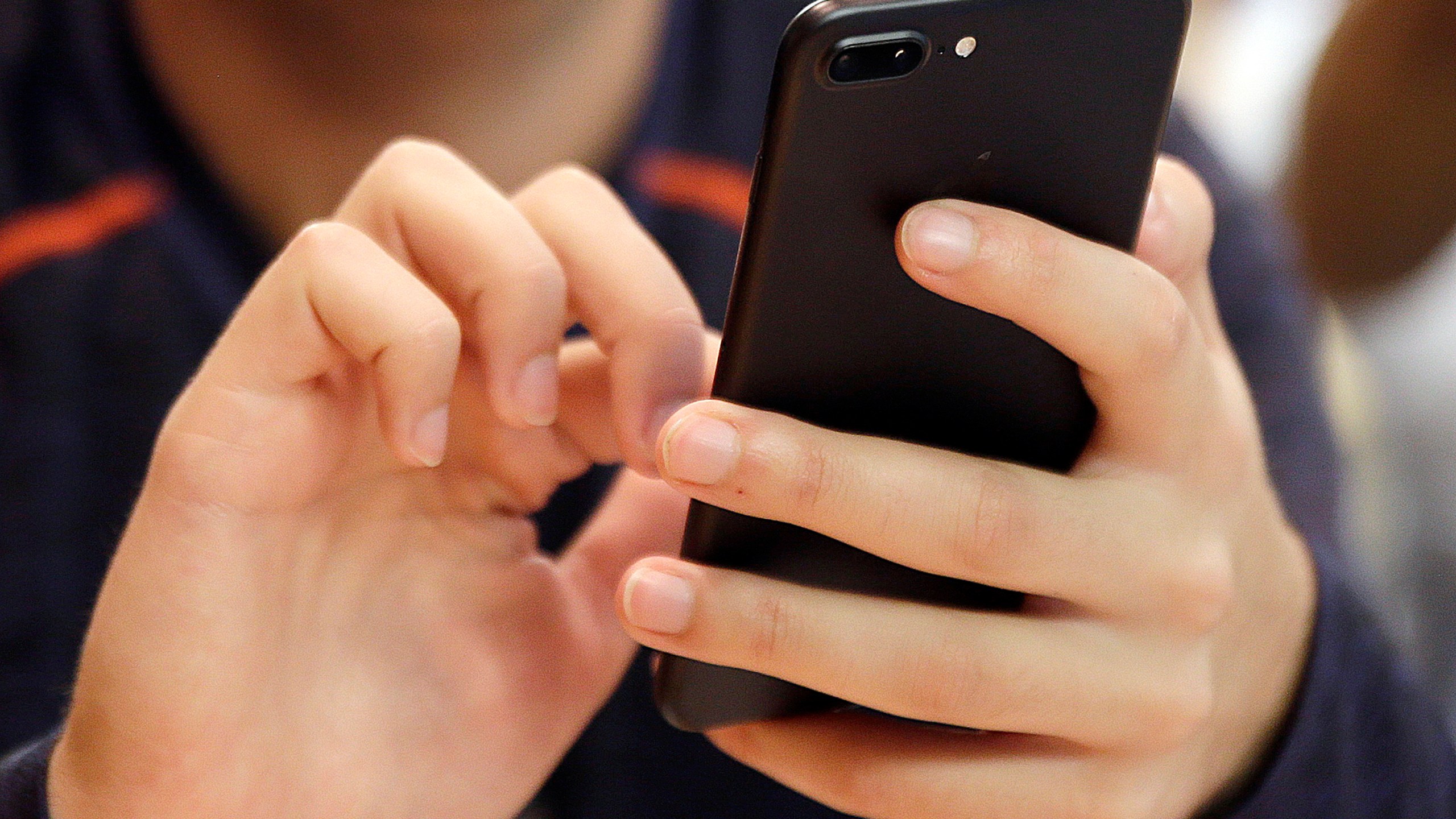 FILE - A person uses a smartphone in Chicago, Sept. 16, 2017. Most Democrats and Republicans agree that the federal government should better regulate the biggest technology companies, particularly social media platforms. But there is very little consensus on how it should be done. (AP Photo, File)