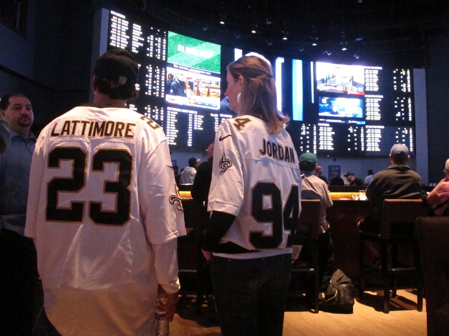 FILE - Customers at the Ocean Casino Resort in Atlantic City N.J. on Sept. 9, 2018, await the kickoff of the first NFL season after a US Supreme Court ruling clearing the way for legal sports betting. Americans have bet over $220 billion on sports with legal gambling outlets in the five years since that ruling. (AP Photo/Wayne Parry, File)