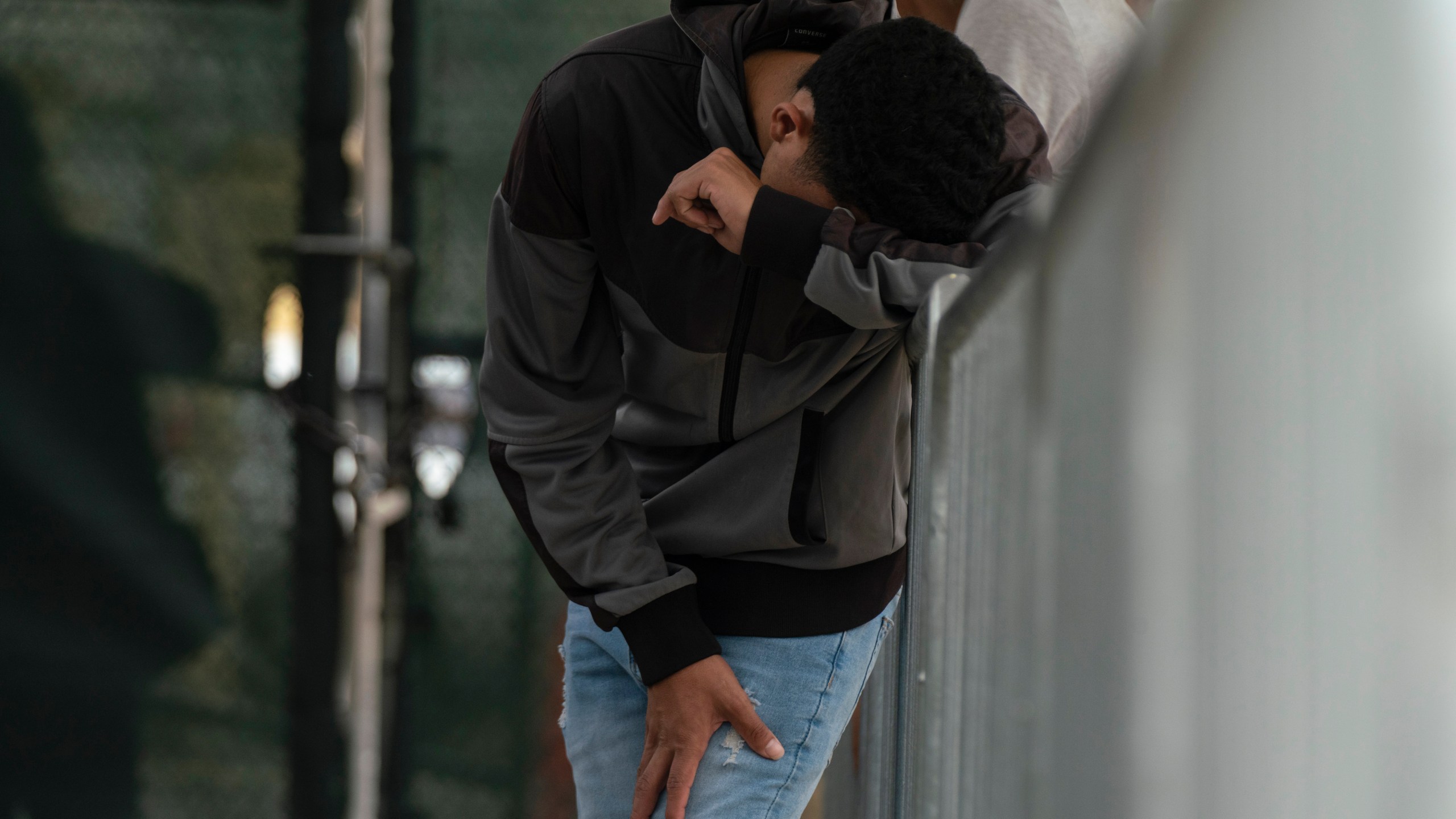 A migrant waits at the Gateway International Port of Entry under U.S. Customs and Border Protection custody in Brownsville, Texas, Friday, May 5, 2023, before being sent back to Mexico under Title 42. (AP Photo/Veronica G. Cardenas)