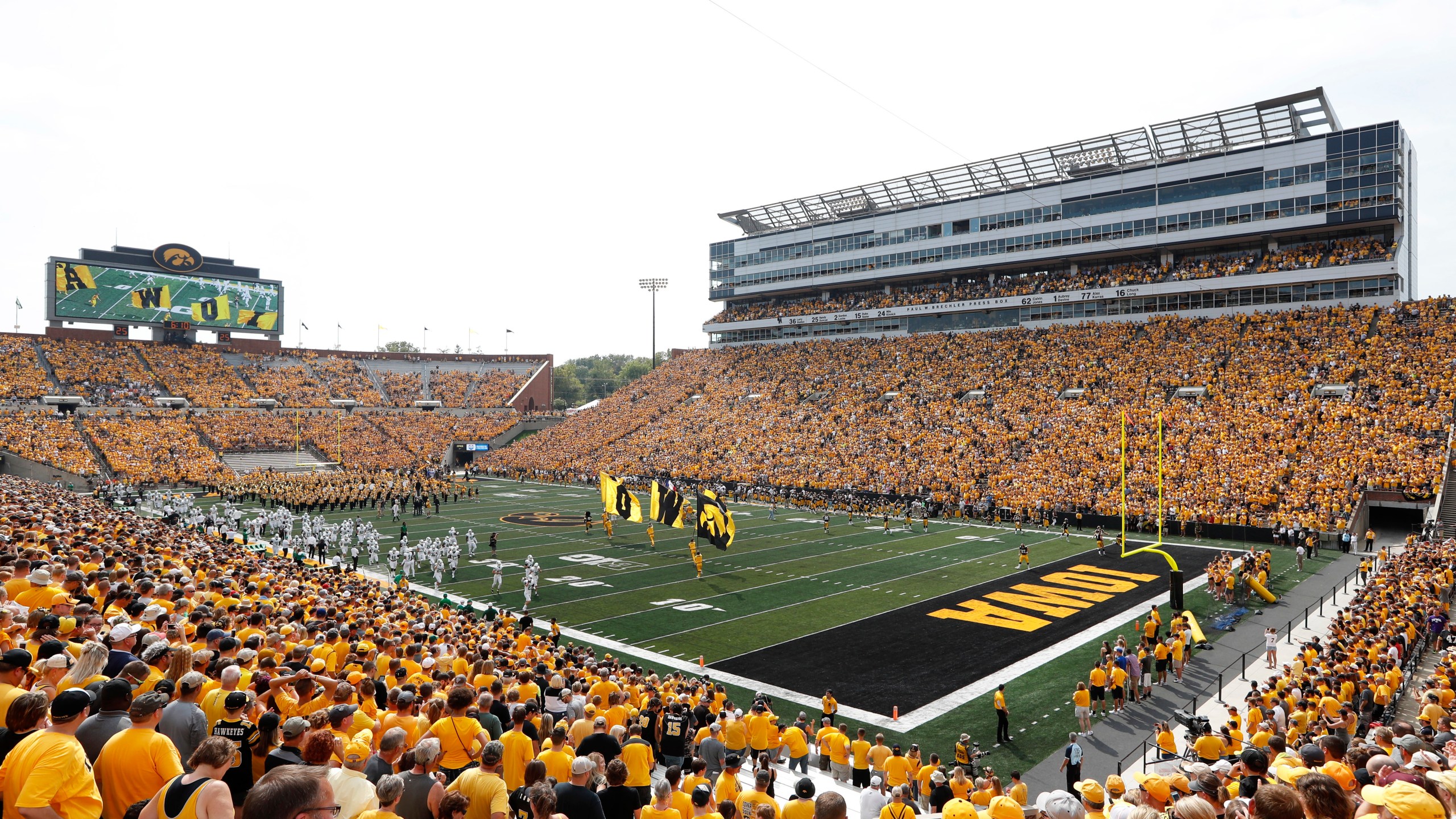 FILE - Fans cheer before an NCAA college football game between Iowa and North Texas at Kinnick Stadium in Iowa City, Iowa, Sept. 16, 2017. The University of Iowa announced 26 of its athletes across five sports are alleged to have participated in sports wagering in violation of NCAA rules. (AP Photo/Charlie Neibergall, File)