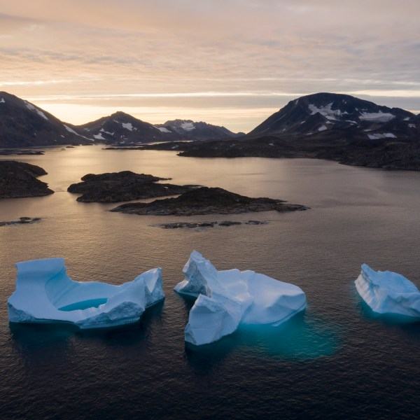 FILE - Large Icebergs float away as the sun rises near Kulusuk, Greenland, Aug. 16, 2019. Norway has taken over the Arctic Council’s rotating presidency from Russia on Thursday, May 11, 2023 amid concerns that the work of the eight-country intergovernmental body on protecting the sensitive environment is at risk due to suspension of cooperation with Moscow over the Ukraine war. Research involving Russia ranging from climate work to mapping polar bears have been put on hold and scientists have lost access to important facilities in the Russian Arctic. (AP Photo/Felipe Dana, File)