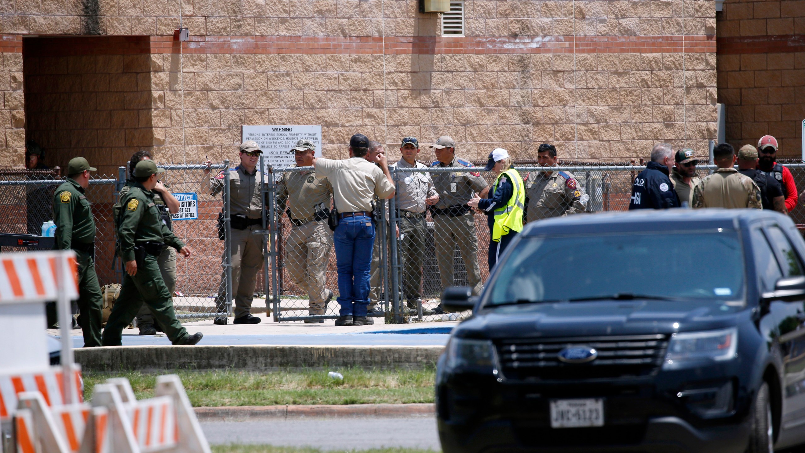 FILE - Law enforcement, and other first responders, gather outside Robb Elementary School following a shooting, May 24, 2022, in Uvalde, Texas. A criminal investigation in Texas over the hesitant police response to the Robb Elementary School shooting remains ongoing a year after a gunman killed 19 children and two teachers in Uvalde. (AP Photo/Dario Lopez-Mills, File)