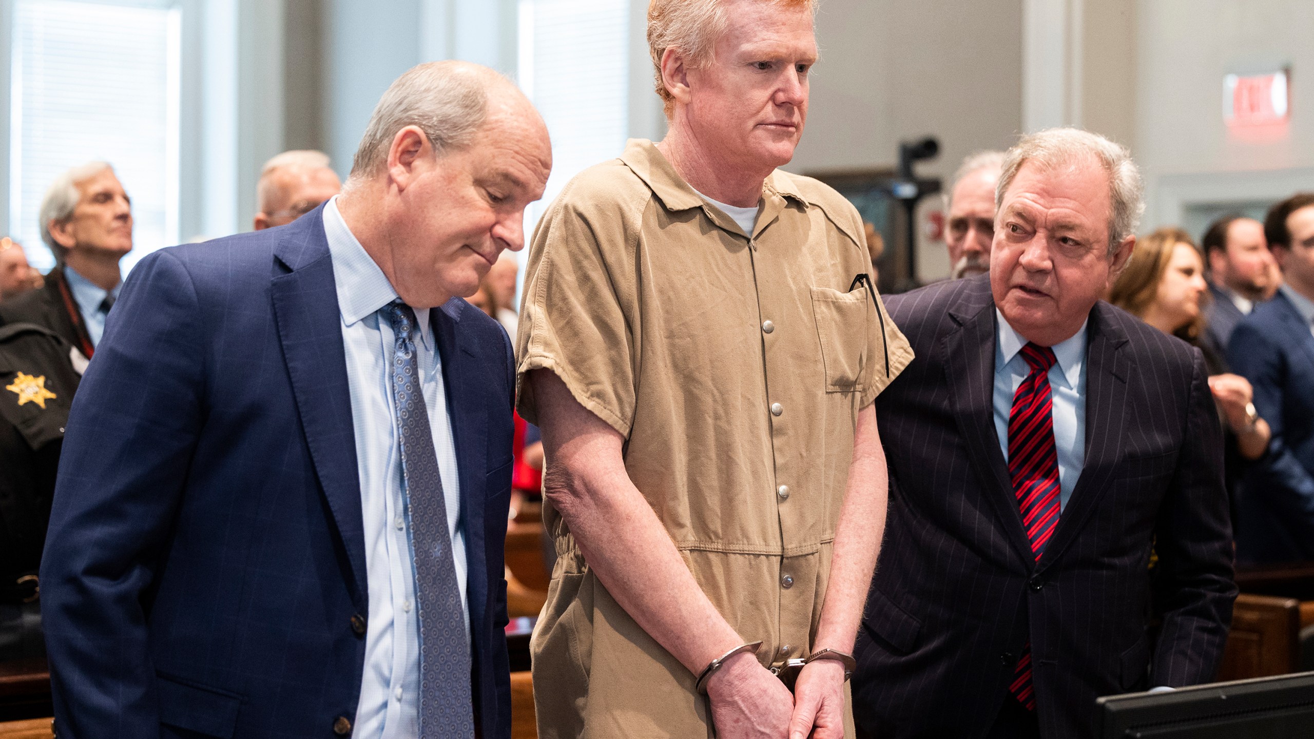 FILE - Alex Murdaugh speaks with his legal team before he is sentenced to two consecutive life sentences for the murder of his wife and son by Judge Clifton Newman at the Colleton County Courthouse on Friday, March 3, 2023 in in Walterboro, S.C. Convicted murderer Murdaugh is facing federal charges for the first time after being indicted on 22 financial fraud charges related to schemes the former attorney used to steal settlement money from clients. (Joshua Boucher/The State via AP, Pool, File)