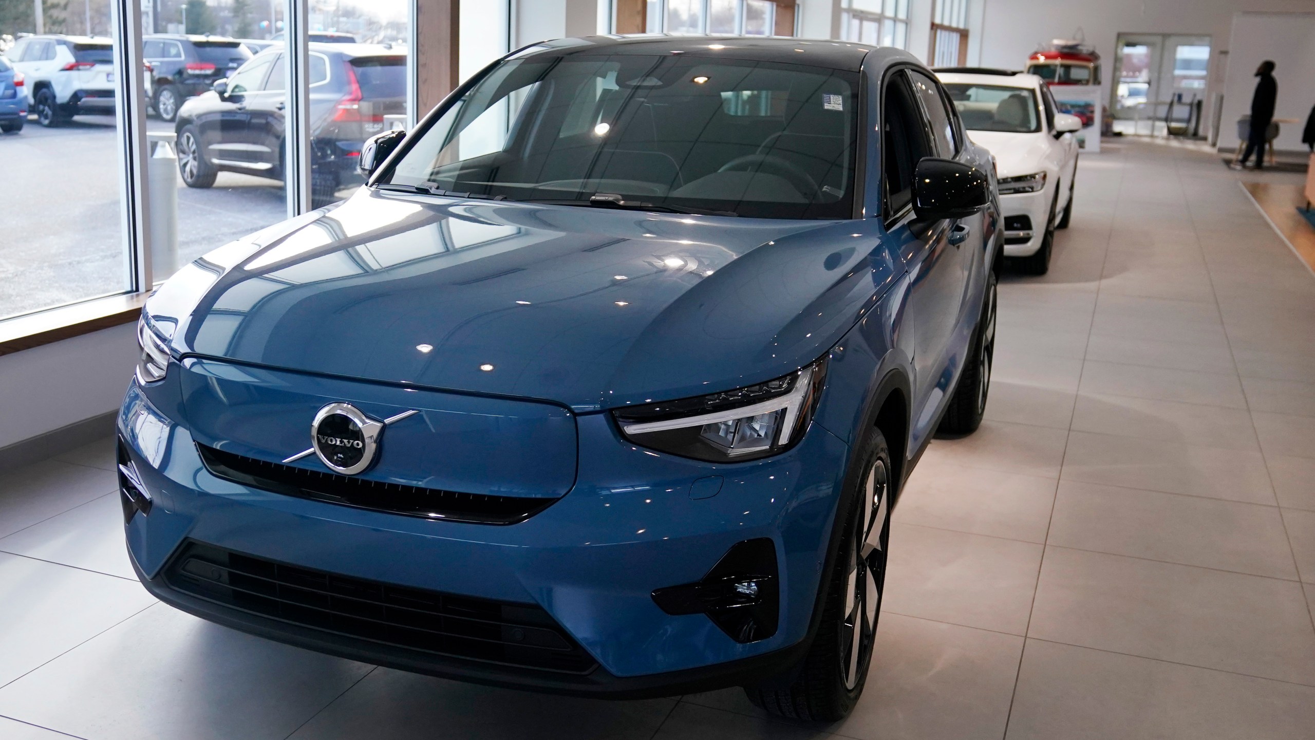 A 2023 Volvo C40 electric vehicle is displayed at a dealership, Tuesday, Feb. 7, 2023, in Exeter, N.H. Leasing is starting to look like the cheapest way to get an electric vehicle, because the U.S. government is giving it a big advantage. Dealers can apply up to the full $7,500 U.S. tax credit to leases of all electric vehicles regardless of where they're made.(AP Photo/Charles Krupa)