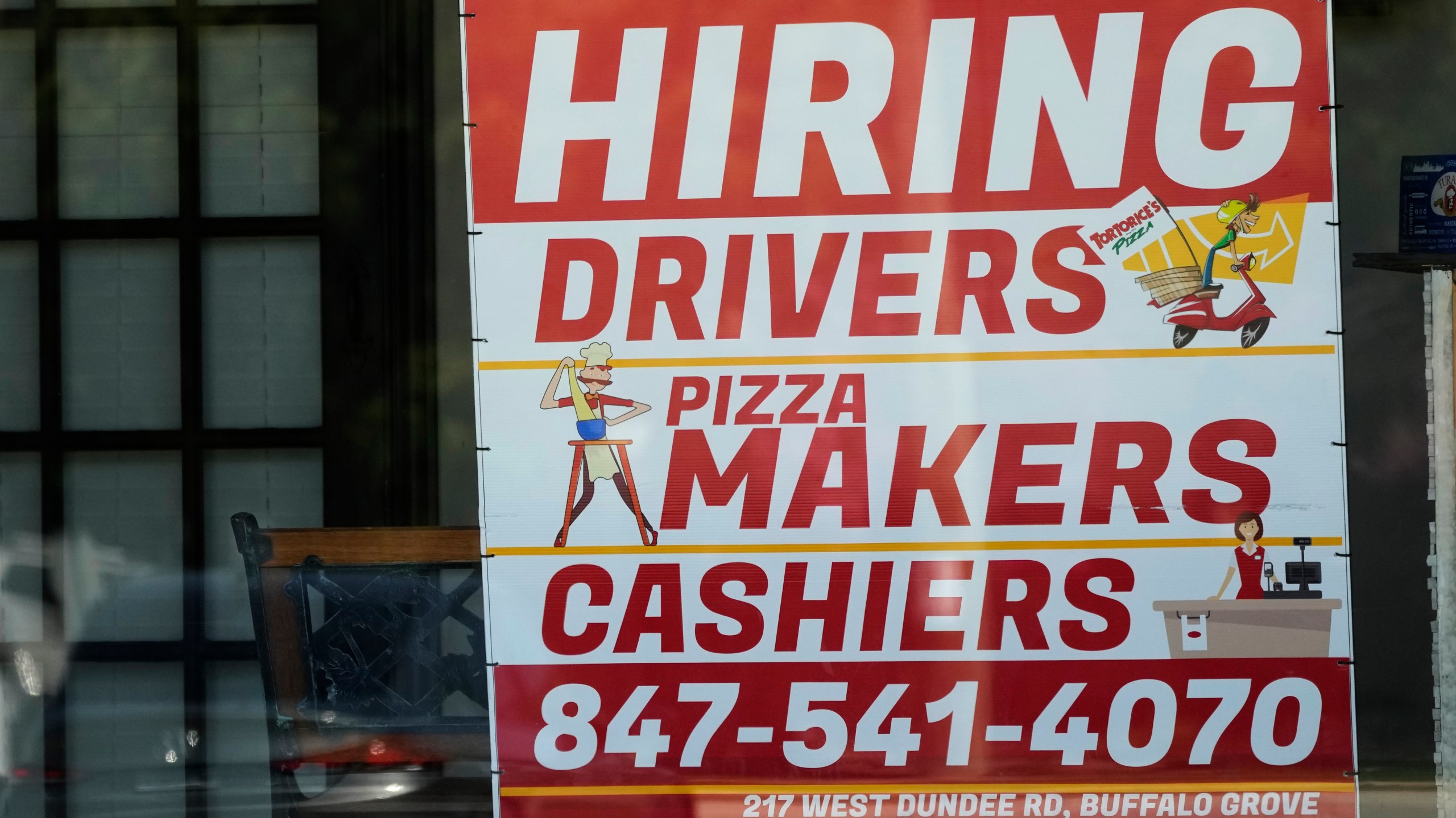 A hiring sign is displayed at a restaurant in Buffalo Grove, Ill., Wednesday, May 10, 2023. On Wednesday, the Labor Department reports on job openings and labor turnover for April. (AP Photo/Nam Y. Huh)