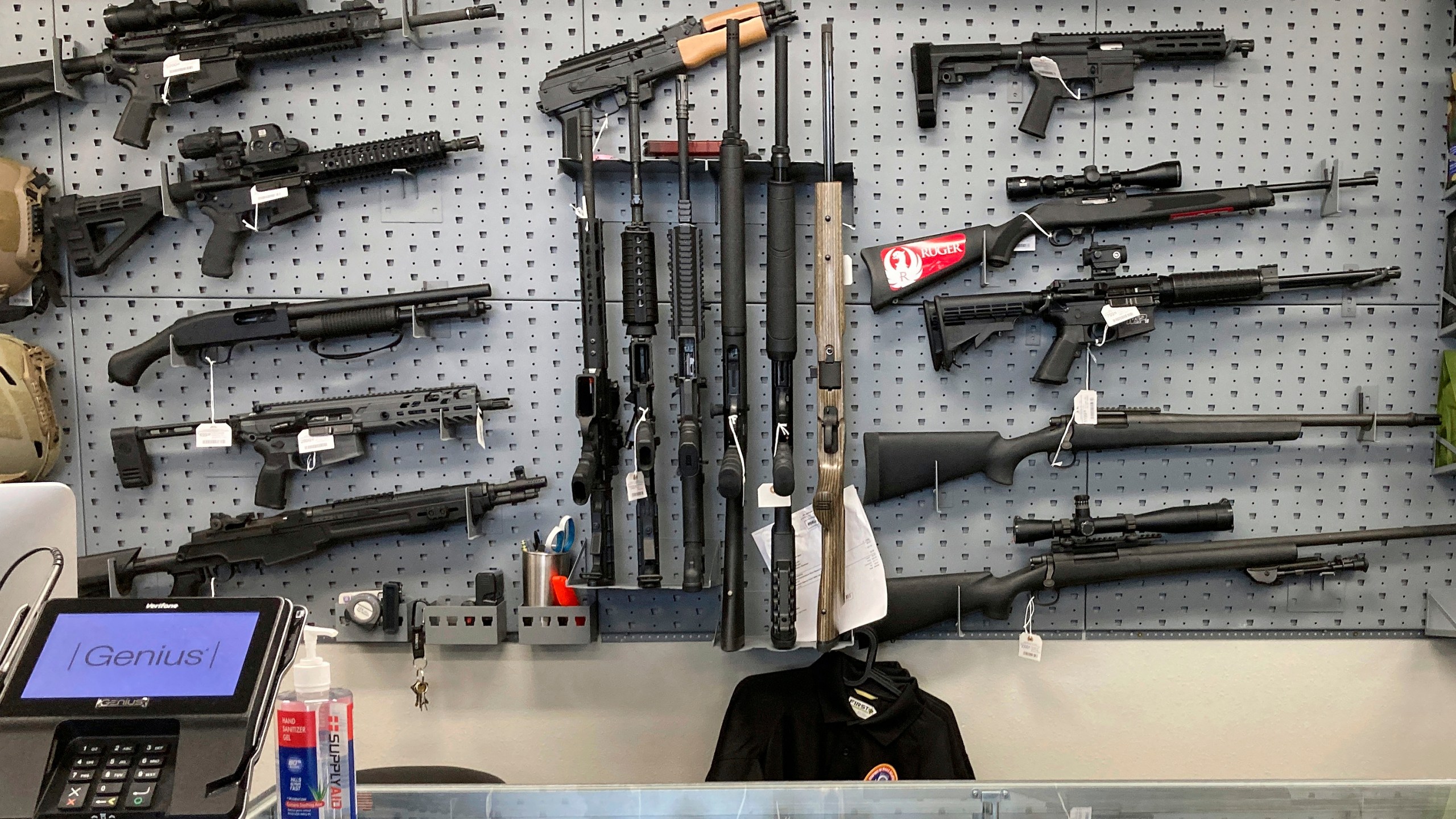 FILE - Firearms are displayed at a gun shop in Salem, Ore., Feb. 19, 2021. A federal judge in Portland, Ore., will hear arguments Monday, June 5, 2023, over the constitutionality of one of the nation's strictest gun control laws that was approved by voters last year. The law, which includes a permit-to-purchase provision for gun owners, has been challenged in both federal court and state court and the legal battle over Measure 114 is likely to continue no matter the outcome this week. (AP Photo/Andrew Selsky, File)