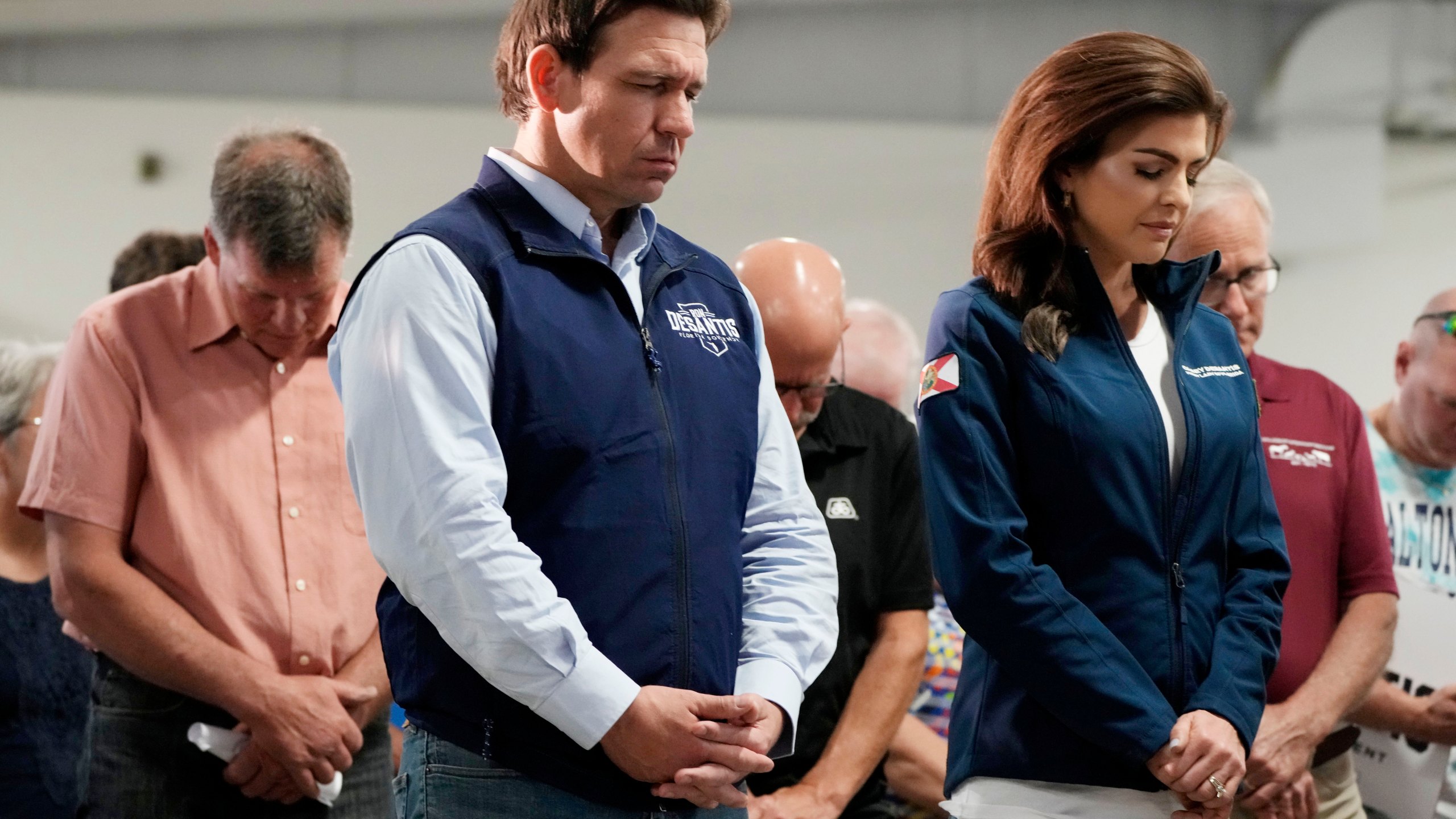 FILE - Republican presidential candidate Florida Gov. Ron DeSantis and his wife, Casey, bow their heads during a prayer at a campaign event, Wednesday, May 31, 2023, in Cedar Rapids, Iowa. (AP Photo/Charlie Neibergall, File)