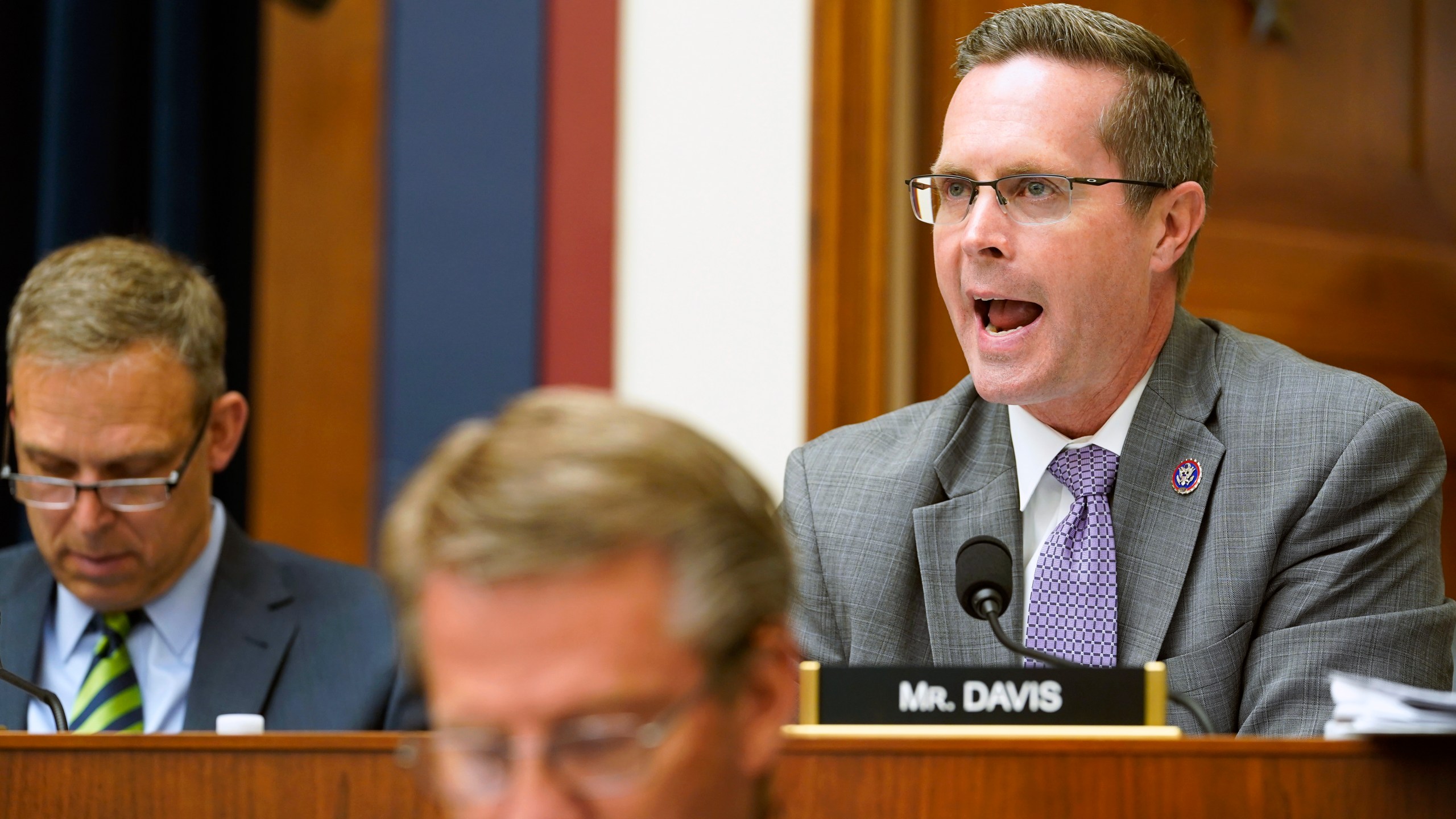 FILE - Rep. Rodney Davis, R-Ill., right, speaks during a House Committee on Transportation and Infrastructure on Capitol Hill in Washington, May 18, 2022. Davis was drawn out of the 13th District he represented for a decade and placed in the heavily Republican 15th District. He lost in a GOP primary to Rep. Mary Miller in 2022, who was endorsed by former President Donald Trump. The reshaped 13th District was won by Democrat Nikki Budzinski, a former aide to Pritzker and President Joe Biden. (AP Photo/Mariam Zuhaib, File)