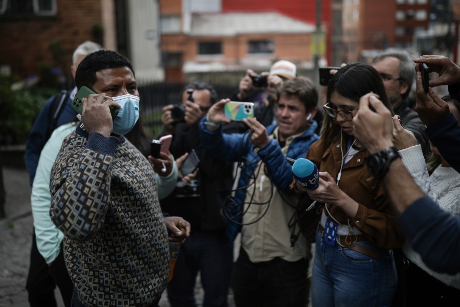 Manuel Ranoque, father of two of the youngest Indigenous children who survived an Amazon plane crash that killed three adults, and then braved the jungle for 40 days before being found alive, speaks to the media from the entrance of the military hospital where the children are receiving medical attention, in Bogota, Colombia, Sunday, June 11, 2023. (AP Photo/Ivan Valencia)