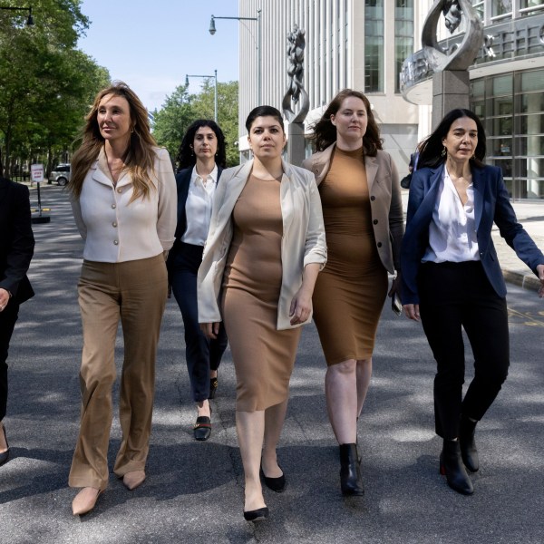 Nicole Daedone, second from left, founder and former CEO of OneTaste, second from left, departs Brooklyn federal court on Tuesday, June 13, 2023, in New York. Daedone, an entrepreneur who promoted group “orgasmic meditation” as a road to women’s well-being, turned herself in and pleaded not guilty Tuesday to a charge of manipulating traumatized people into debt, undesired sex and underpaid work. (AP Photo/Jeenah Moon)