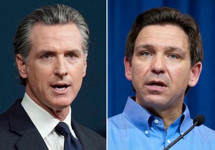 This combination of photos shows California Gov. Gavin Newsom speaking in Sacramento, Calif., on June 24, 2022, left, and Florida Gov. Ron DeSantis speaking in Sioux Center, Iowa, May 13, 2023, right. (AP Photo)