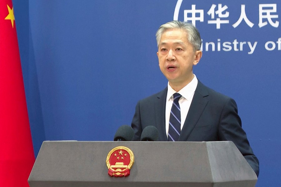 Chinese Foreign Ministry spokesperson Wang Wenbin speaks during a press conference at the Ministry of Foreign Affairs in Beijing, Friday, June 16, 2023. China's government on Friday rejected as "far-fetched and unprofessional" a report by a U.S. security firm that blamed Chinese-linked hackers for attacks on hundreds of public agencies, schools and other targets around the world. (AP Photo/Liu Zheng)