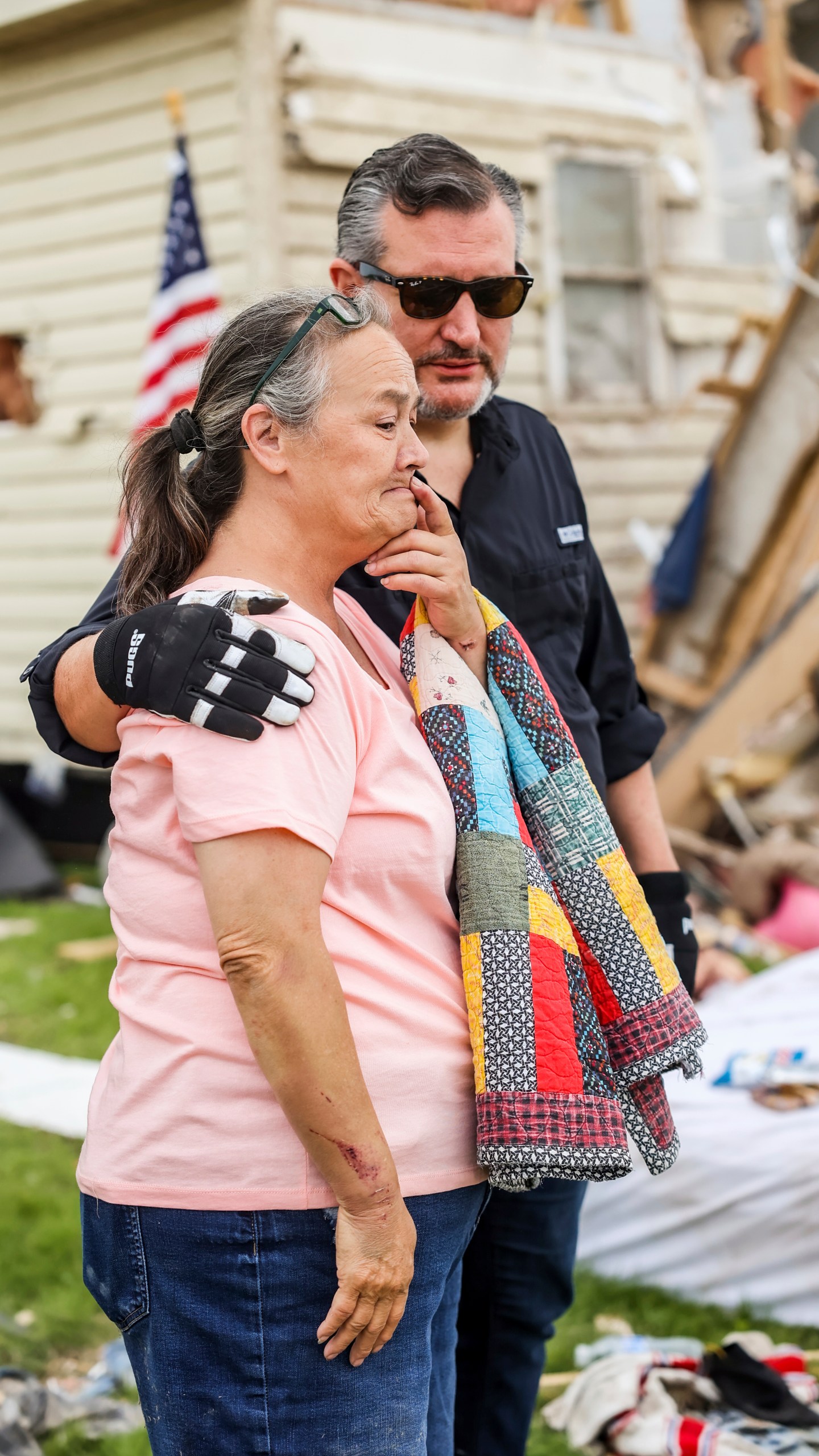 U.S. Sen. Ted Cruz, R-Texas, consoles a woman as he surveys the damage of her home from a recent tornado in Perryton, Texas, Saturday, June 17, 2023. (AP Photo/David Erickson)