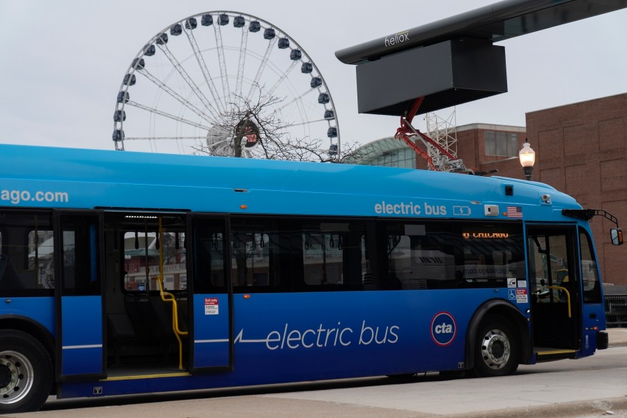 FILE - A Chicago Transit Authority electric bus charges at Navy Pier Tuesday, Feb. 14, 2023, in Chicago. The Transportation Department is awarding almost $1.7 billion in grants for buying zero and low emission buses, with the money going to transit projects in 46 states and territories. The grants will enable transit agencies and state and local governments to buy 1,700 U.S.-built buses, nearly half of which will have zero carbon emissions. (AP Photo/Erin Hooley, File)