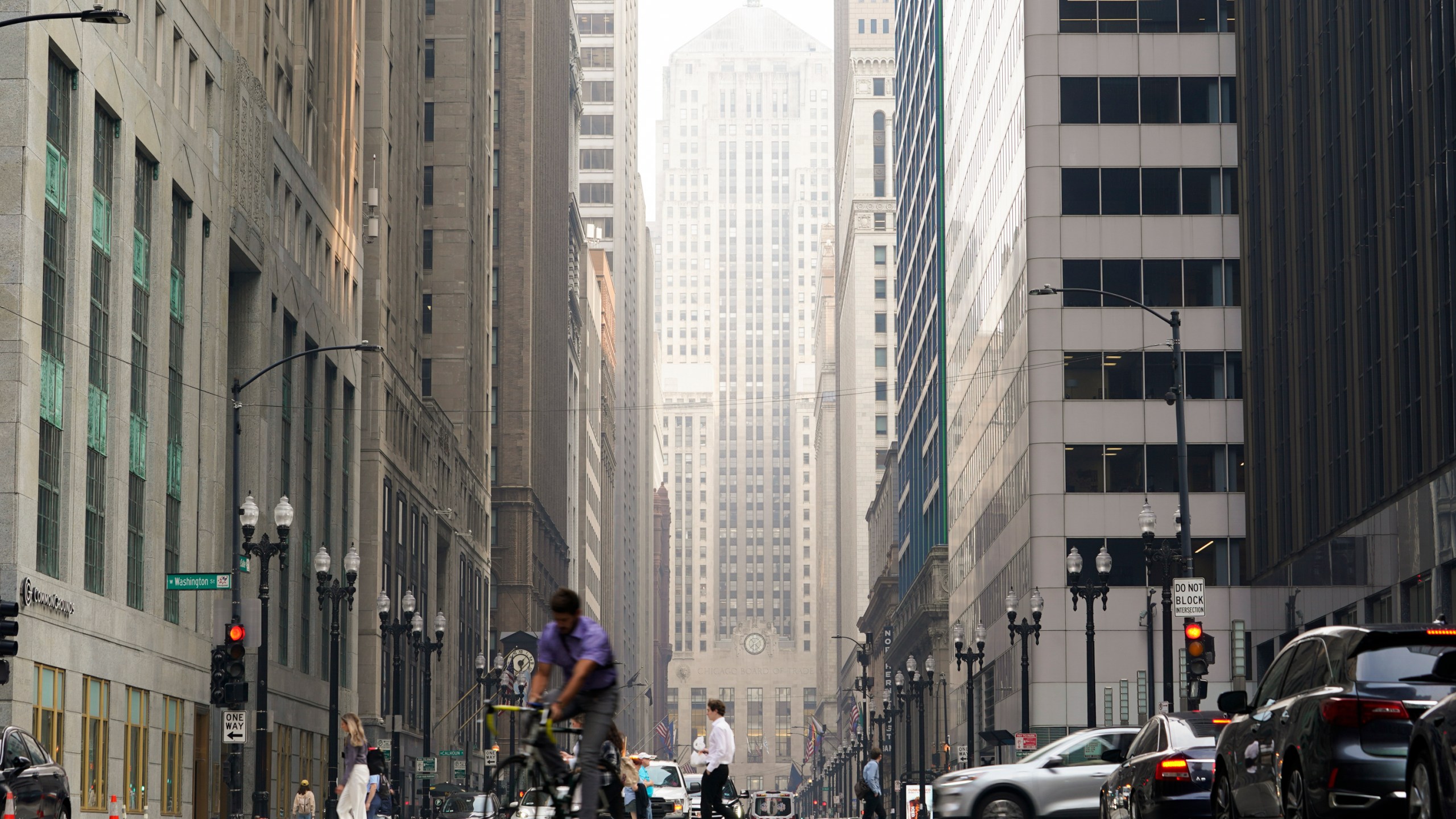 The Chicago Board of Trade building is blanketed in haze from Canadian wildfires Wednesday, June 28, 2023, in Chicago. (AP Photo/Kiichiro Sato)