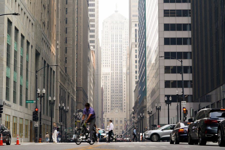 The Chicago Board of Trade building is blanketed in haze from Canadian wildfires Wednesday, June 28, 2023, in Chicago. (AP Photo/Kiichiro Sato)