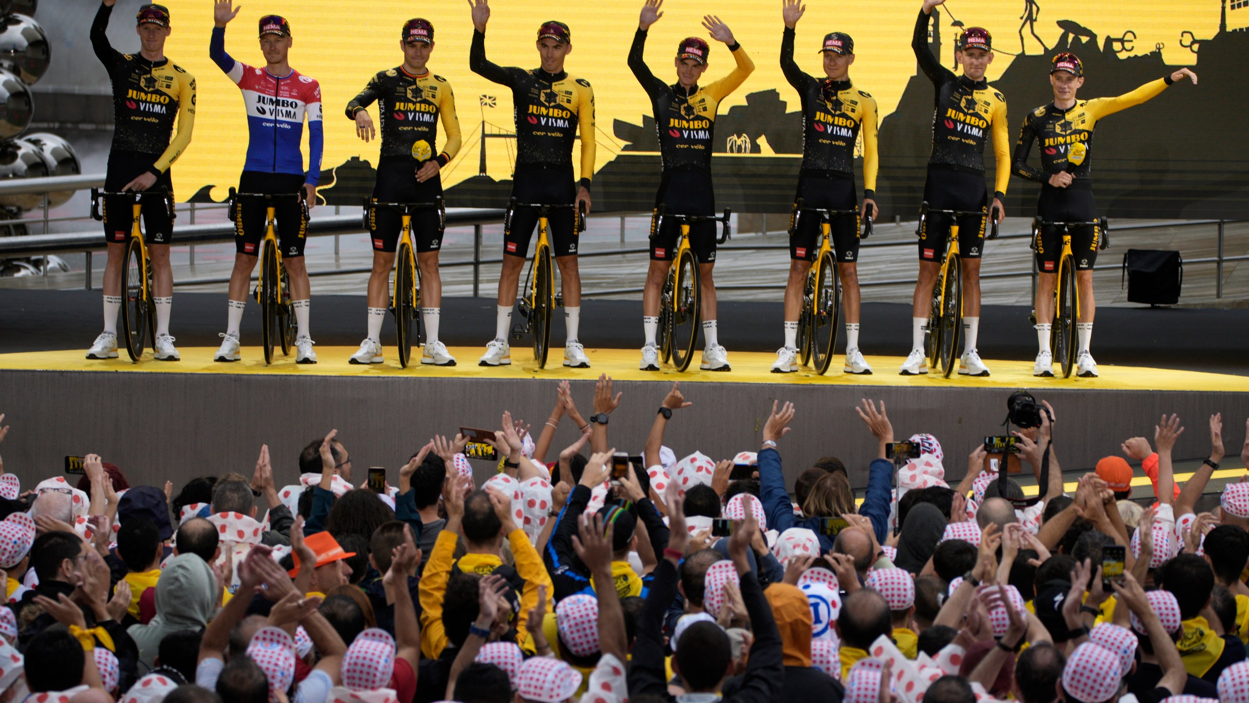 Jumbo Visma cycling team riders pose during the team presentation ahead of the Tour de France cycling race in Bilbao, Spain, Thursday, June 29, 2023. The race starts on Saturday, July 1, with the first stage over 182 kilometers (113 miles) with start and finish in Bilbao. (AP Photo/Daniel Cole)