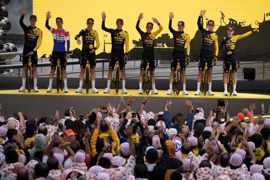 Jumbo Visma cycling team riders pose during the team presentation ahead of the Tour de France cycling race in Bilbao, Spain, Thursday, June 29, 2023. The race starts on Saturday, July 1, with the first stage over 182 kilometers (113 miles) with start and finish in Bilbao. (AP Photo/Daniel Cole)