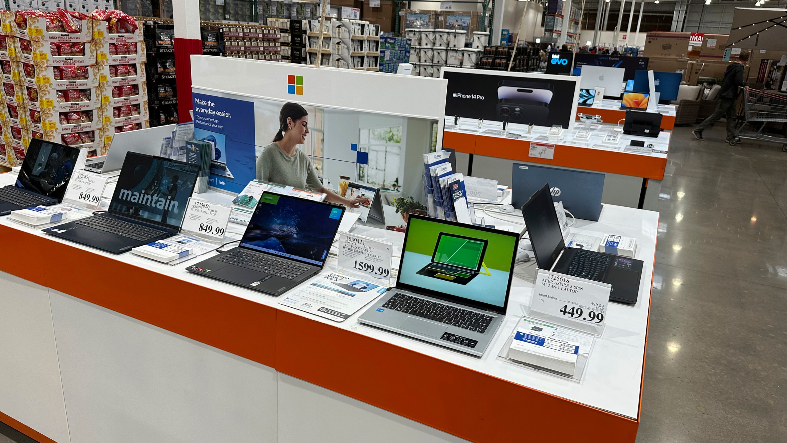 Laptop computers are displayed in a Costco warehouse Monday, June 6, 2023, in Colorado Springs, Colo. On Wednesday, the Labor Department reports on U.S. consumer prices for June. (AP Photo/David Zalubowski)