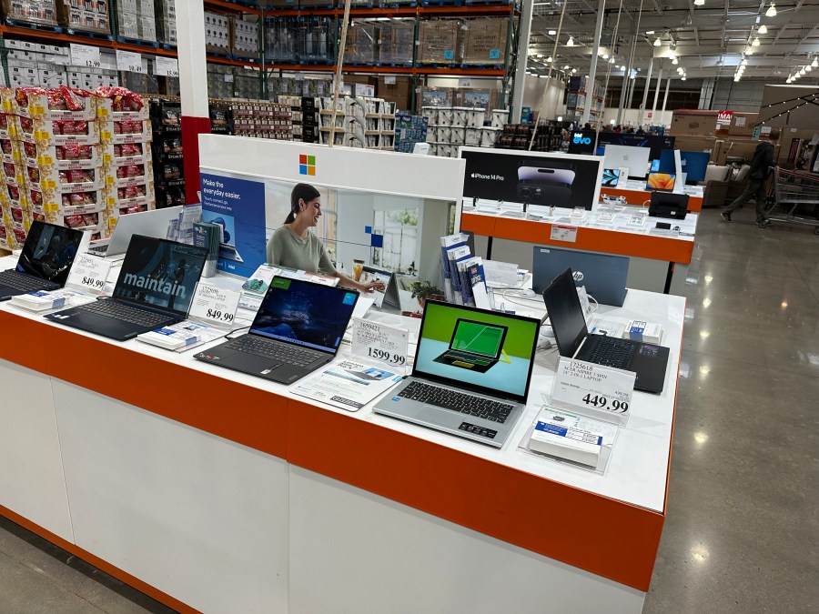 Laptop computers are displayed in a Costco warehouse Monday, June 6, 2023, in Colorado Springs, Colo. On Wednesday, the Labor Department reports on U.S. consumer prices for June. (AP Photo/David Zalubowski)