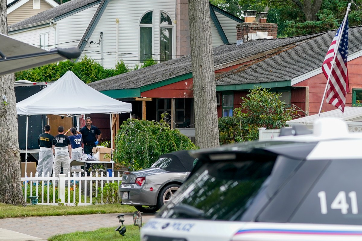 Authorities search the home of suspect Rex Heuermann, Tuesday, July 18, 2023, in Massapequa Park, N.Y. Detectives investigating the long-unsolved slayings known as the Gilgo Beach killings have continued their searches, recently including a storage facility in the Long Island community of Amityville over the weekend. (AP Photo/John Minchillo)