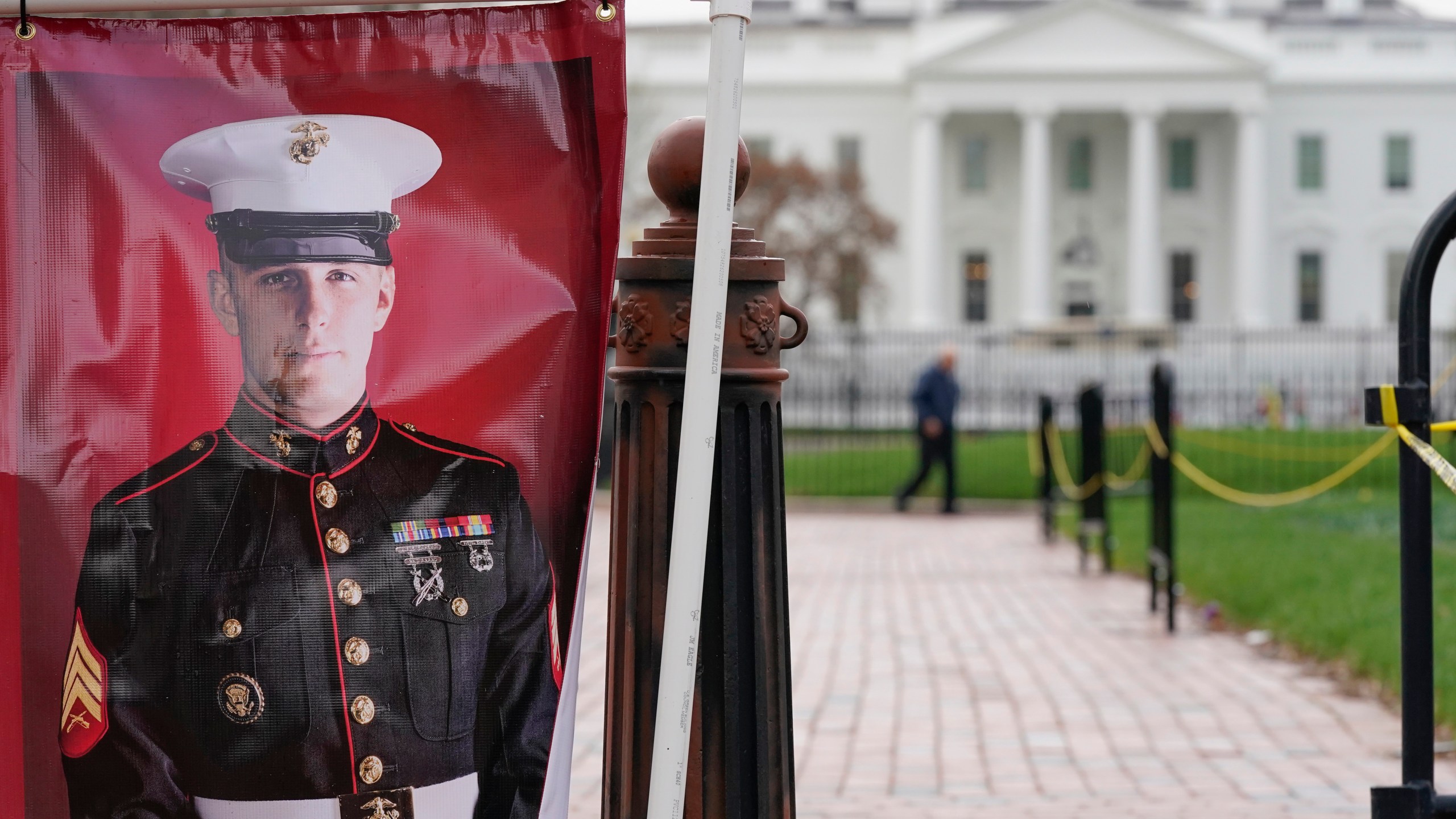 FILE - A poster photo of U.S. Marine Corps veteran and former Russian prisoner Trevor Reed stands in Lafayette Park near the White House, March 30, 2022, in Washington. Reed, a former U.S. Marine who was released from Russia in a prisoner swap last year, has been injured while fighting in Ukraine, the State Department and a person familiar with the matter said Tuesday. (AP Photo/Patrick Semansky, File)