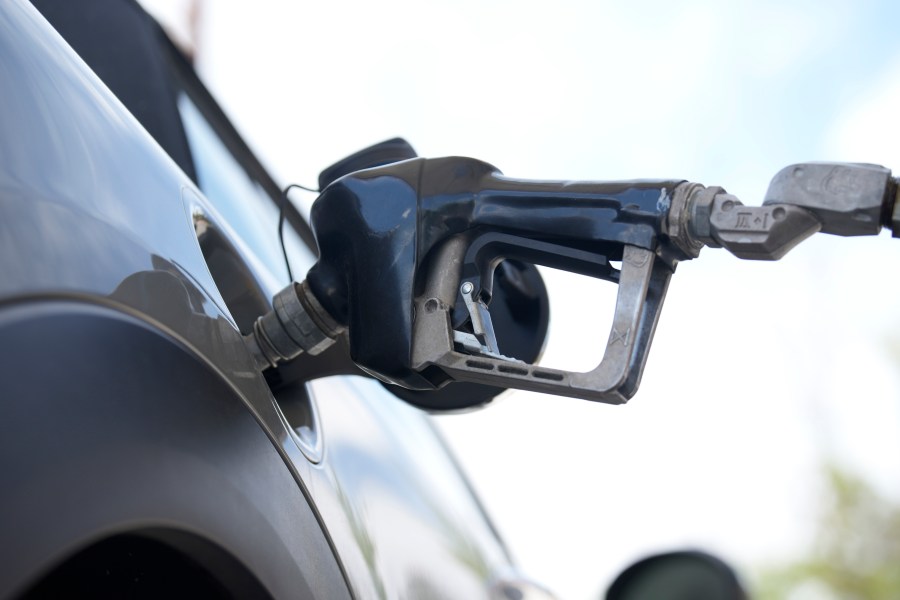 A motorist fills up a vehicle at a Shell gasoline station Sunday, June 18, 2023, in Englewood, Colo. The most-anticipated recession probably in modern U.S. history still hasn't arrived. Despite higher borrowing costs, thanks to the Federal Reserve's aggressive streak of interest rate hikes, consumers keep spending, and employers keep hiring. Gas prices are falling and grocery prices have leveled off, giving Americans more spending power. (AP Photo/David Zalubowski)