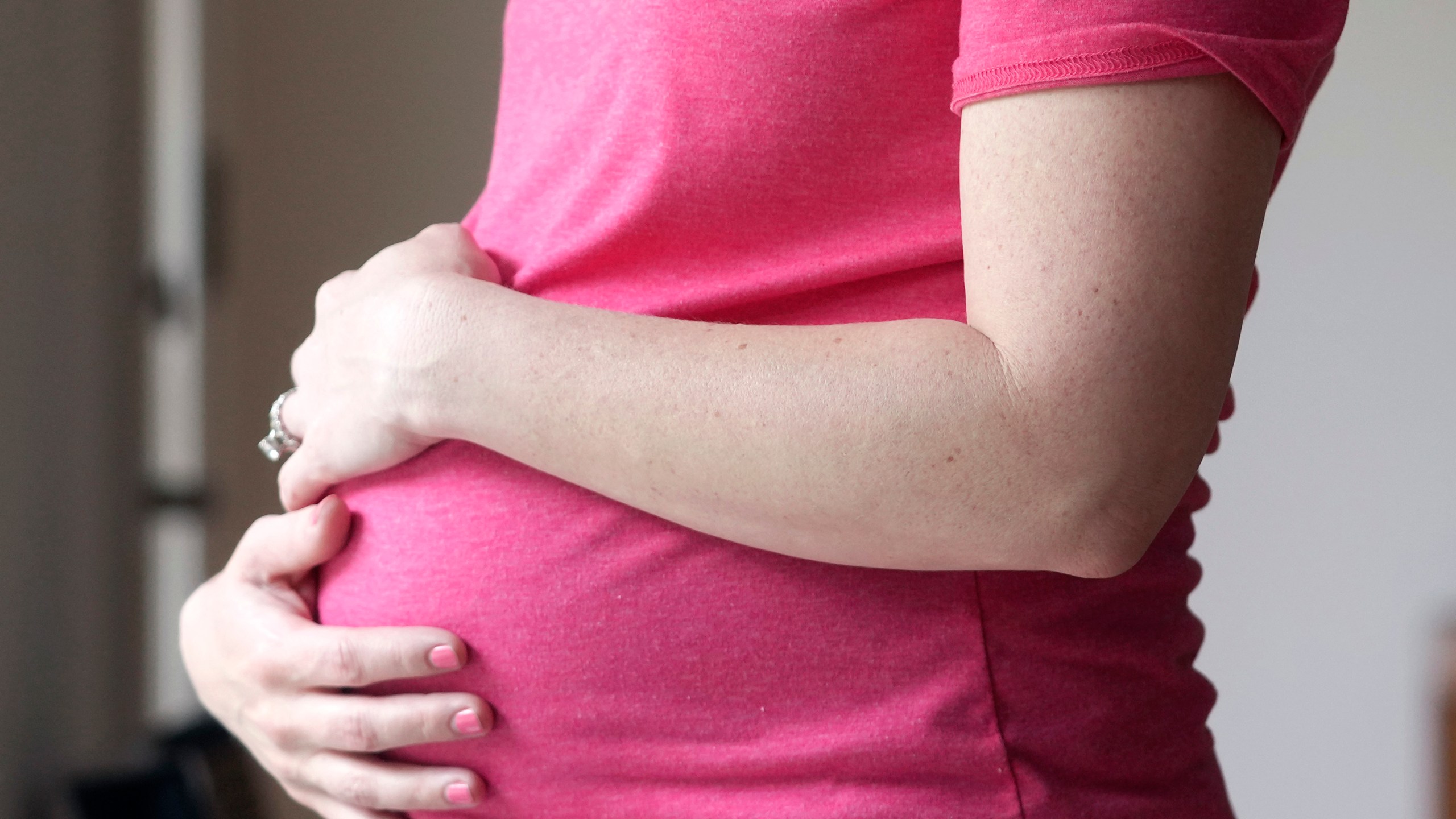 FILE - A pregnant woman stands for a portrait in Dallas, Thursday, May 18, 2023. On Friday, Aug. 4, 2023, U.S. health officials approved the first pill, Zurzuvae, specifically intended to treat severe depression after childbirth, a condition that affects thousands of new mothers in the U.S. each year. (AP Photo/LM Otero, File)