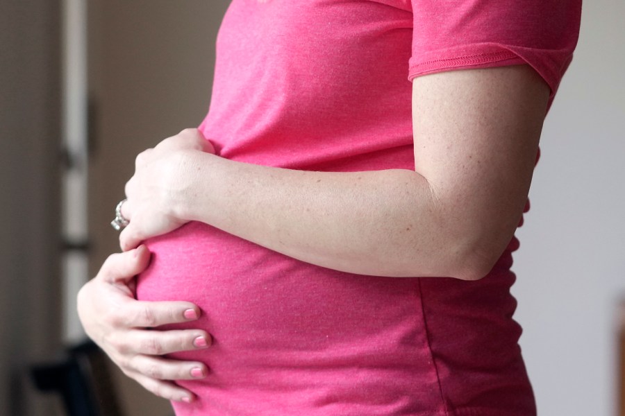 FILE - A pregnant woman stands for a portrait in Dallas, Thursday, May 18, 2023. On Friday, Aug. 4, 2023, U.S. health officials approved the first pill, Zurzuvae, specifically intended to treat severe depression after childbirth, a condition that affects thousands of new mothers in the U.S. each year. (AP Photo/LM Otero, File)