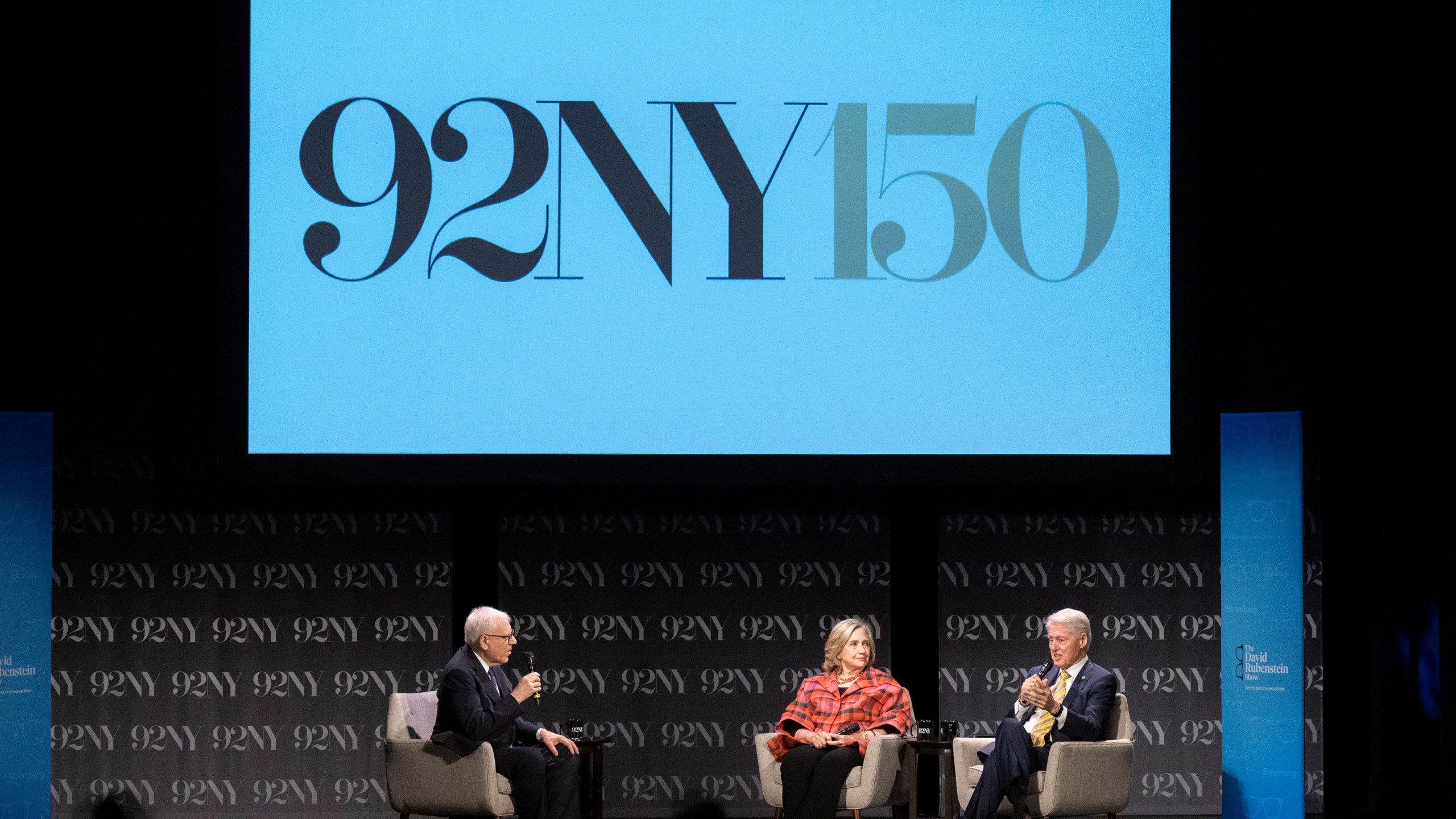 FILE - Former President Bill Clinton, right, and former Secretary of State Hillary Rodham Clinton, center, speak with David Rubenstein at the 92nd Street Y on May 4, 2023, in New York. Oprah Winfrey, Rachel Maddow and Arnold Schwarzenegger will be among those appearing this fall at the 92nd Street Y, a New York City cultural institution and community center marking its 150th anniversary. (Photo by Evan Agostini/Invision/AP, File)