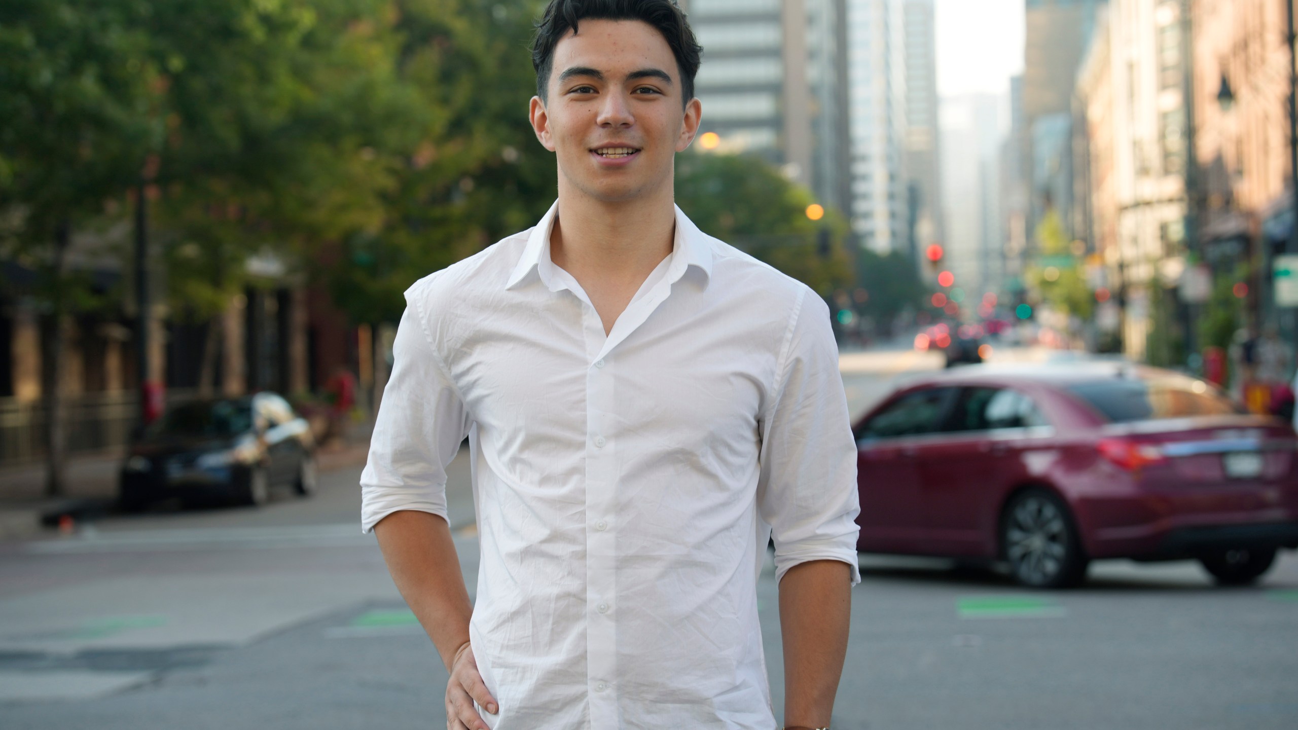 Ronan Takizawa, a student at Colorado College in Colorado Springs, Colo., is shown outside Union Station on the way to boarding a bus for his 65-mile commute to class from downtown Denver early Monday, Aug. 7, 2023, in Denver. (AP Photo/David Zalubowski)